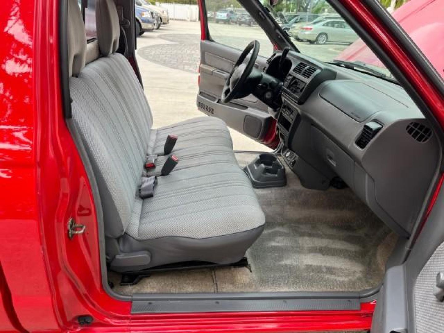 1999 Aztec Red /Gray Nissan Frontier 2WD PU 1 FL XE LOW MILES 56,259 (1N6DD21S5XC) with an 2.4L DOHC SMPI 16-Valve 4-Cyl Engine engine, Automatic transmission, located at 4701 North Dixie Hwy, Pompano Beach, FL, 33064, (954) 422-2889, 26.240938, -80.123474 - 1999 NISSAN FRONTIER XE AUTO AC BEAUTIFUL ROAD READY 2.4L I4 VIN: 1N6DD21S5XC310801 NO ACCIDENTS PICKUP NO RECALLS 6,5 FT BED 2.4L I4 F DOHC 1 OWNER FLORIDA GASOLINE 10 SERVICE RECORDS REAR WHEEL DRIVE LOW MILES 56,259 Alloy Wheels Cloth Seats Bed Liner ABS Brakes Air Conditioning Cassette Player AM - Photo#12