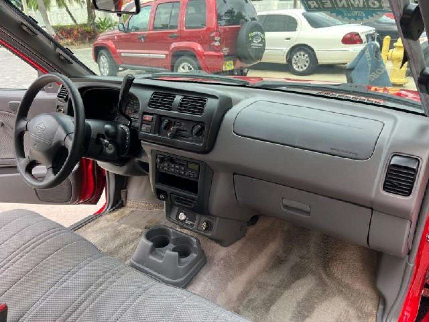 1999 Aztec Red /Gray Nissan Frontier 2WD PU 1 FL XE LOW MILES 56,259 (1N6DD21S5XC) with an 2.4L DOHC SMPI 16-Valve 4-Cyl Engine engine, Automatic transmission, located at 4701 North Dixie Hwy, Pompano Beach, FL, 33064, (954) 422-2889, 26.240938, -80.123474 - 1999 NISSAN FRONTIER XE AUTO AC BEAUTIFUL ROAD READY 2.4L I4 VIN: 1N6DD21S5XC310801 NO ACCIDENTS PICKUP NO RECALLS 6,5 FT BED 2.4L I4 F DOHC 1 OWNER FLORIDA GASOLINE 10 SERVICE RECORDS REAR WHEEL DRIVE LOW MILES 56,259 Alloy Wheels Cloth Seats Bed Liner ABS Brakes Air Conditioning Cassette Player AM - Photo#21