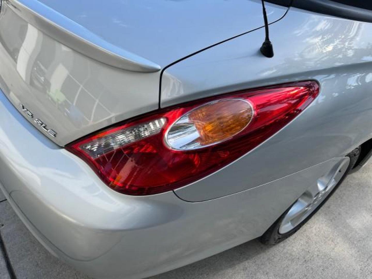 2005 Lunar Mist Metallic /Dark Charcoal Toyota Camry Solara SLE LOW MILES 34,834 (4T1FA38P15U) with an 3.3L DOHC SEFI VVT-i 24-Valve V6 Engine engine, Automatic transmission, located at 4701 North Dixie Hwy, Pompano Beach, FL, 33064, (954) 422-2889, 26.240938, -80.123474 - 2005 TOYOTA CAMRY SOLARA SLE V6 ROAD READY 3.3L V6 VIN: 4T1FA38P15U049746 LOW MILES 34,834 CONVERTIBLE FLORIDA OWNER 29 MPG 3.3L V6 F DOHC 24V SLE POWER CONVERTIBLE TOP GASOLINE NO RECALLS POWER LEATHER SEATS FRONT WHEEL DRIVE NO ACCIDENTS 14 SERVICE RECORDS Alloy Wheels Anti-Theft System Auto-dimmi - Photo#99