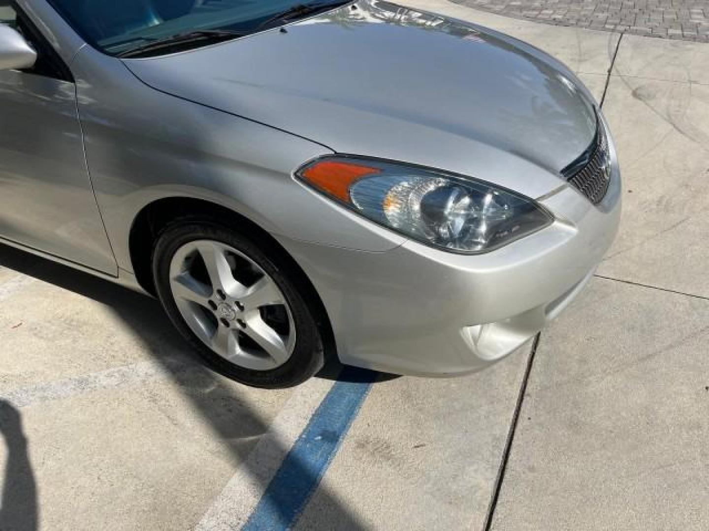 2005 Lunar Mist Metallic /Dark Charcoal Toyota Camry Solara SLE LOW MILES 34,834 (4T1FA38P15U) with an 3.3L DOHC SEFI VVT-i 24-Valve V6 Engine engine, Automatic transmission, located at 4701 North Dixie Hwy, Pompano Beach, FL, 33064, (954) 422-2889, 26.240938, -80.123474 - 2005 TOYOTA CAMRY SOLARA SLE V6 ROAD READY 3.3L V6 VIN: 4T1FA38P15U049746 LOW MILES 34,834 CONVERTIBLE FLORIDA OWNER 29 MPG 3.3L V6 F DOHC 24V SLE POWER CONVERTIBLE TOP GASOLINE NO RECALLS POWER LEATHER SEATS FRONT WHEEL DRIVE NO ACCIDENTS 14 SERVICE RECORDS Alloy Wheels Anti-Theft System Auto-dimmi - Photo#79