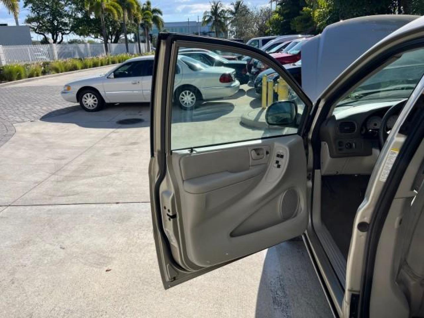 2005 Linen Gold Metallic Pearl /Medium Slate Gray Dodge Caravan SXT LOW MILES 60,664 (2D4GP44L95R) with an 3.8L SMPI V6 Engine engine, Automatic transmission, located at 4701 North Dixie Hwy, Pompano Beach, FL, 33064, (954) 422-2889, 26.240938, -80.123474 - 2005 DODGE GRAND CARAVAN SXT ROAD READY 3.8L V6 VIN: 2D4GP44L95R464538 LOW MILES 60,664 VAN NO ACCIDENTS NO RECALLS 3.8L V6 F FLORIDA OWNER GASOLINE 12 SERVICE RECORDS POWER SLIDING DOORS FRONT WHEEL DRIVE DUAL ZONE AC POWER SEATS/MIRRORS Additional Airbags Alloy Wheels Automatic Climate Control Bla - Photo#9