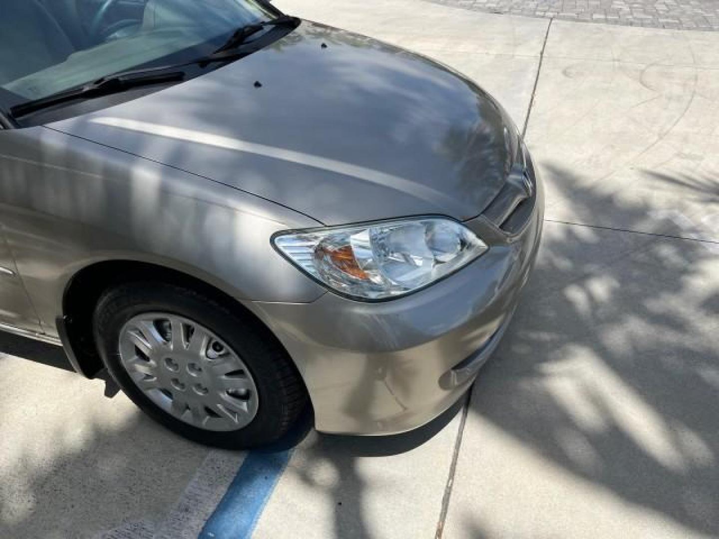 2004 Satin Silver Metallic /Gray Honda Civic LX LOW MILES 26,419 (2HGES165X4H) with an 1.7L SOHC MPFI 16-Valve I4 Engine engine, Automatic transmission, located at 4701 North Dixie Hwy, Pompano Beach, FL, 33064, (954) 422-2889, 26.240938, -80.123474 - 2004 HONDA CIVIC LX ROAD READY 1.7L I4 VIN: 2HGES165X4H591708 FLORIDA OWNER 38 MPG SEDAN 4 DR NO ACCIDENTS 1.7L I4 F SOHC 16V NO RECALLS GASOLINE POWER MIRRORS FRONT WHEEL DRIVE SUPER LOW MILES 26,419 Approach Lights Cruise Control FWD Front Bucket Seats THIS IS ONE OF THE NICEST HONDA S WE HAVE EVE - Photo#71