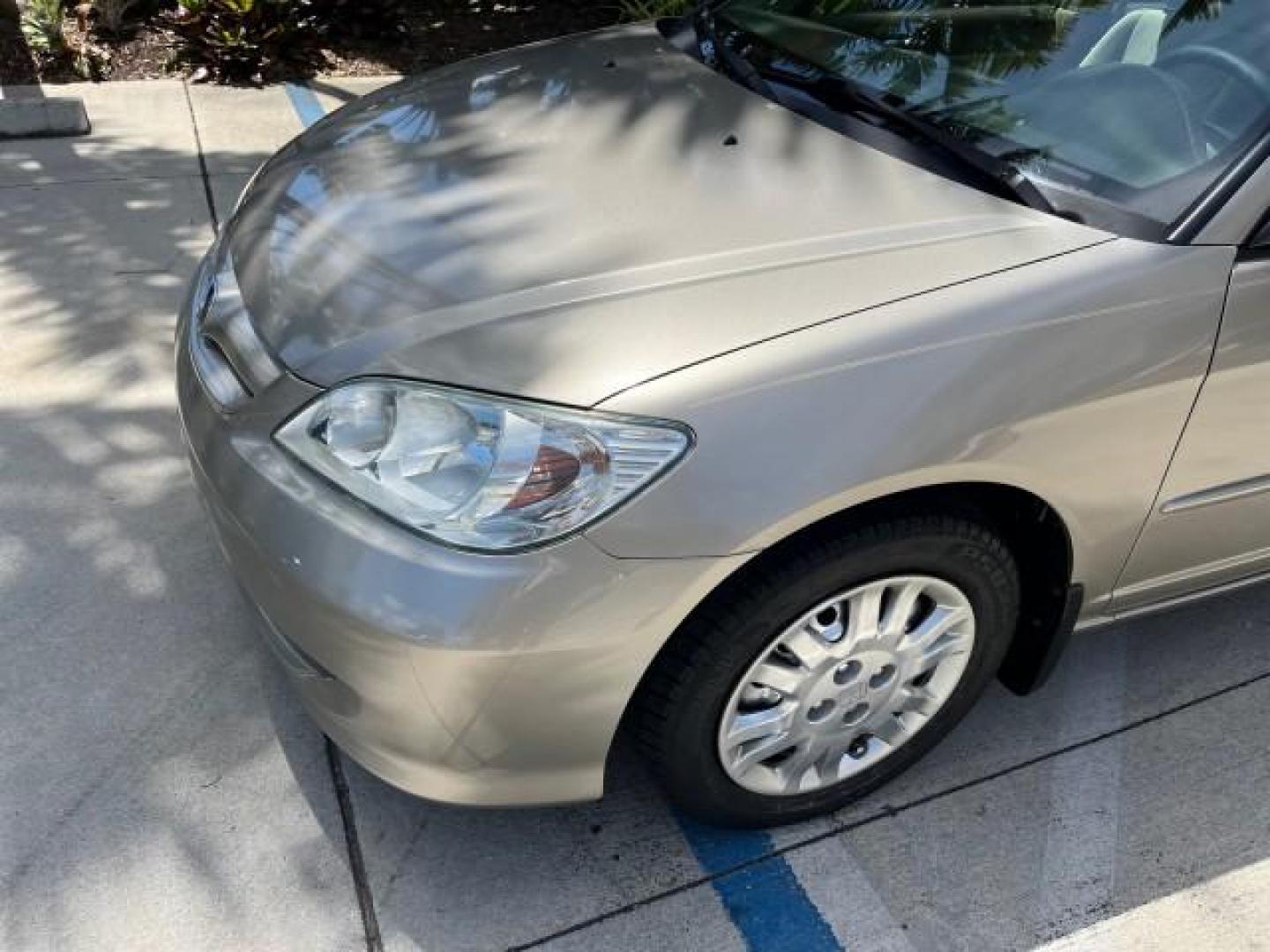 2004 Satin Silver Metallic /Gray Honda Civic LX LOW MILES 26,419 (2HGES165X4H) with an 1.7L SOHC MPFI 16-Valve I4 Engine engine, Automatic transmission, located at 4701 North Dixie Hwy, Pompano Beach, FL, 33064, (954) 422-2889, 26.240938, -80.123474 - 2004 HONDA CIVIC LX ROAD READY 1.7L I4 VIN: 2HGES165X4H591708 FLORIDA OWNER 38 MPG SEDAN 4 DR NO ACCIDENTS 1.7L I4 F SOHC 16V NO RECALLS GASOLINE POWER MIRRORS FRONT WHEEL DRIVE SUPER LOW MILES 26,419 Approach Lights Cruise Control FWD Front Bucket Seats THIS IS ONE OF THE NICEST HONDA S WE HAVE EVE - Photo#72