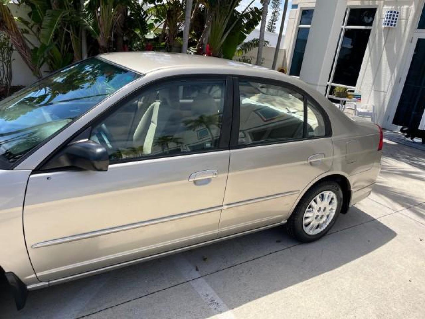 2004 Satin Silver Metallic /Gray Honda Civic LX LOW MILES 26,419 (2HGES165X4H) with an 1.7L SOHC MPFI 16-Valve I4 Engine engine, Automatic transmission, located at 4701 North Dixie Hwy, Pompano Beach, FL, 33064, (954) 422-2889, 26.240938, -80.123474 - 2004 HONDA CIVIC LX ROAD READY 1.7L I4 VIN: 2HGES165X4H591708 FLORIDA OWNER 38 MPG SEDAN 4 DR NO ACCIDENTS 1.7L I4 F SOHC 16V NO RECALLS GASOLINE POWER MIRRORS FRONT WHEEL DRIVE SUPER LOW MILES 26,419 Approach Lights Cruise Control FWD Front Bucket Seats THIS IS ONE OF THE NICEST HONDA S WE HAVE EVE - Photo#74