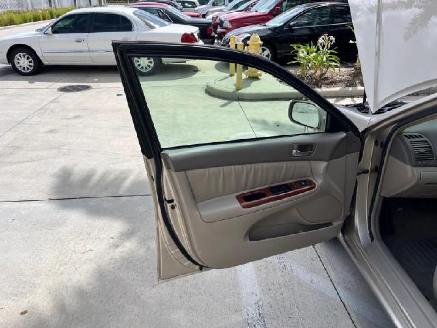 2005 Desert Sand Mica /Taupe Toyota Camry XLE LOW MILES 61,434 (4T1BF30K35U) with an 3.0L DOHC MPFI Vvti 24-Valve V6 Engine engine, Automatic transmission, located at 4701 North Dixie Hwy, Pompano Beach, FL, 33064, (954) 422-2889, 26.240938, -80.123474 - 2005 TOYOTA CAMRY XLE V6 ROAD READY 3.0L V6 VIN: 4T1BF30K35U595917 NO RECALLS 28 MPG SEDAN 4 DR POWER LEATHER SEATS 3.0L V6 F DOHC 24V POWER SUNROOF XLE GASOLINE 32 SERVICE RECORDS FRONT WHEEL DRIVE 1 OWNER LOW MILES 61,434 Alloy Wheels Anti-Theft System Auto-dimming Rearview Mirror Automatic Climat - Photo#9