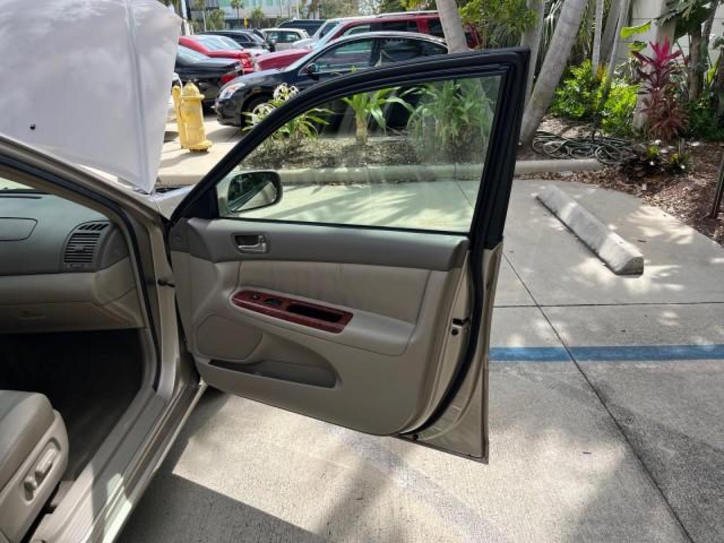 2005 Desert Sand Mica /Taupe Toyota Camry XLE LOW MILES 61,434 (4T1BF30K35U) with an 3.0L DOHC MPFI Vvti 24-Valve V6 Engine engine, Automatic transmission, located at 4701 North Dixie Hwy, Pompano Beach, FL, 33064, (954) 422-2889, 26.240938, -80.123474 - 2005 TOYOTA CAMRY XLE V6 ROAD READY 3.0L V6 VIN: 4T1BF30K35U595917 NO RECALLS 28 MPG SEDAN 4 DR POWER LEATHER SEATS 3.0L V6 F DOHC 24V POWER SUNROOF XLE GASOLINE 32 SERVICE RECORDS FRONT WHEEL DRIVE 1 OWNER LOW MILES 61,434 Alloy Wheels Anti-Theft System Auto-dimming Rearview Mirror Automatic Climat - Photo#11