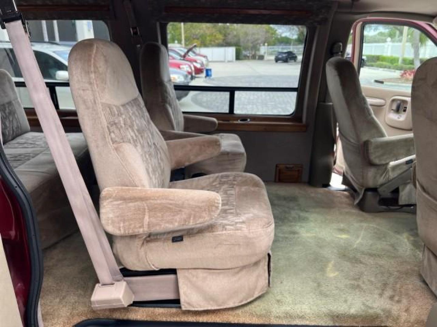 2002 Dark Carmine Red Metallic /Neutral Chevrolet Express Van CONVERSION LOW MILES 94,100 (1GBFG15W621) with an 4.3L Vortec 4300 SFI V6 Gas Engine engine, Automatic transmission, located at 4701 North Dixie Hwy, Pompano Beach, FL, 33064, (954) 422-2889, 26.240938, -80.123474 - 2002 CHEVROLET EXPRESS G1500 ROAD READY 4.3L V6 VIN: 1GBFG15W621192339 NO ACCIDENTS VAN NO RECALLS 4.3L V6 F OHV 12V FLORIDA OWNER GASOLINE LOW MILES 94,100 REAR WHEEL DRIVE THIS IS ONE OF THE NICEST CHEVROLET EXPRESS WE HAVE EVER LISTED RETIRE FLORIDA TITLE THIS IS THE LOWEST MILE FOR THE YEAR WITH - Photo#31