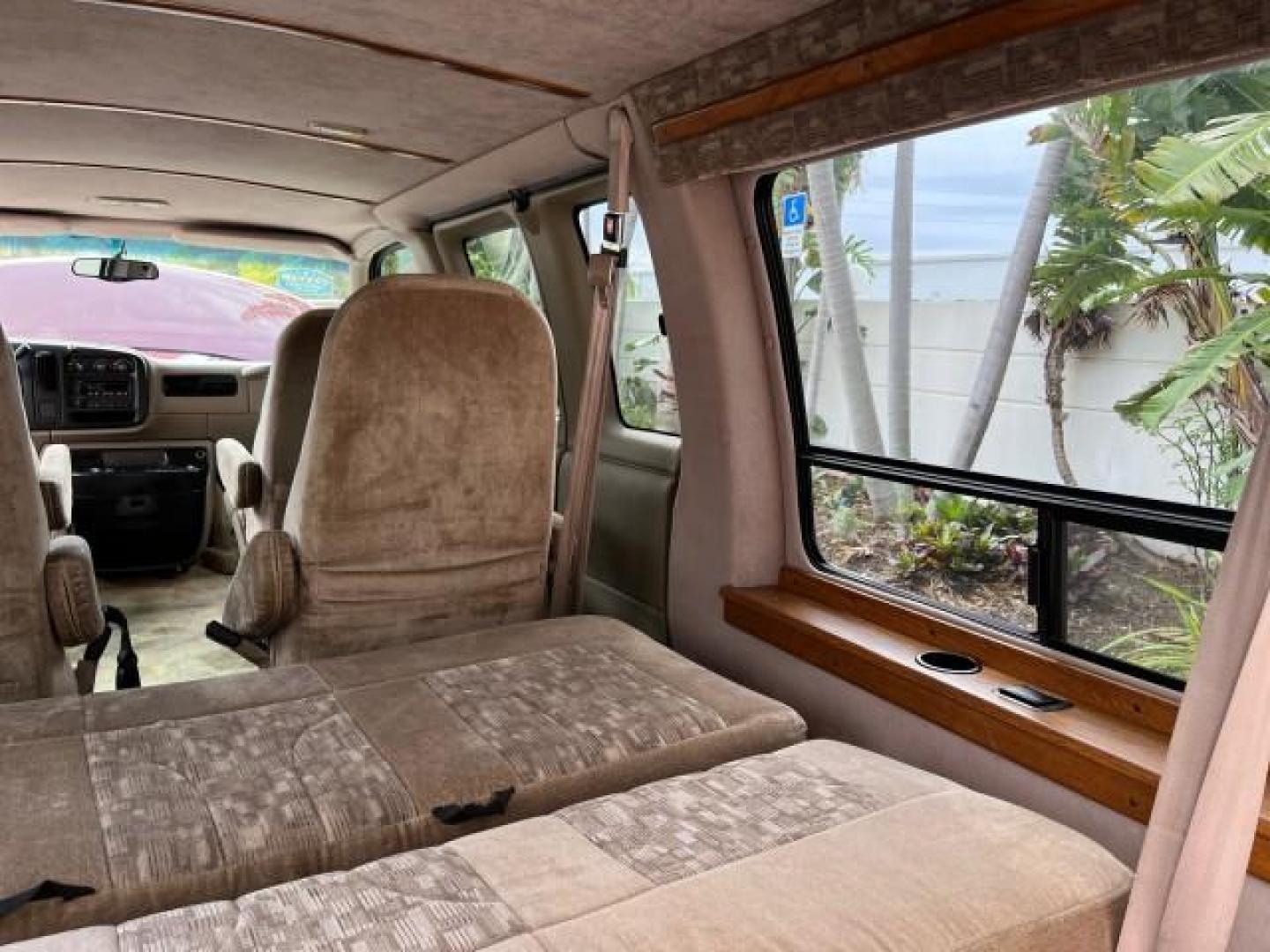 2002 Dark Carmine Red Metallic /Neutral Chevrolet Express Van CONVERSION LOW MILES 94,100 (1GBFG15W621) with an 4.3L Vortec 4300 SFI V6 Gas Engine engine, Automatic transmission, located at 4701 North Dixie Hwy, Pompano Beach, FL, 33064, (954) 422-2889, 26.240938, -80.123474 - 2002 CHEVROLET EXPRESS G1500 ROAD READY 4.3L V6 VIN: 1GBFG15W621192339 NO ACCIDENTS VAN NO RECALLS 4.3L V6 F OHV 12V FLORIDA OWNER GASOLINE LOW MILES 94,100 REAR WHEEL DRIVE THIS IS ONE OF THE NICEST CHEVROLET EXPRESS WE HAVE EVER LISTED RETIRE FLORIDA TITLE THIS IS THE LOWEST MILE FOR THE YEAR WITH - Photo#49