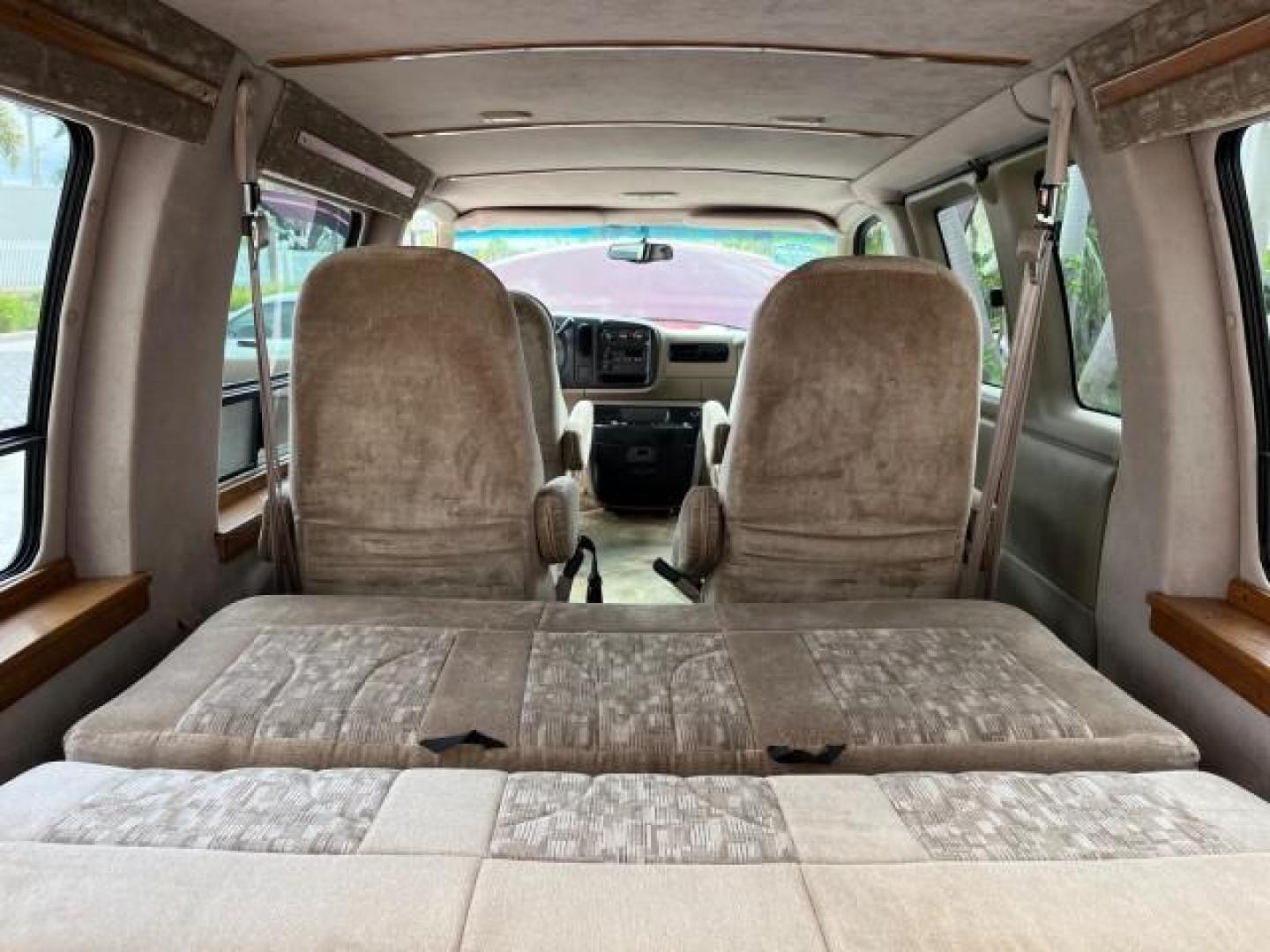 2002 Dark Carmine Red Metallic /Neutral Chevrolet Express Van CONVERSION LOW MILES 94,100 (1GBFG15W621) with an 4.3L Vortec 4300 SFI V6 Gas Engine engine, Automatic transmission, located at 4701 North Dixie Hwy, Pompano Beach, FL, 33064, (954) 422-2889, 26.240938, -80.123474 - 2002 CHEVROLET EXPRESS G1500 ROAD READY 4.3L V6 VIN: 1GBFG15W621192339 NO ACCIDENTS VAN NO RECALLS 4.3L V6 F OHV 12V FLORIDA OWNER GASOLINE LOW MILES 94,100 REAR WHEEL DRIVE THIS IS ONE OF THE NICEST CHEVROLET EXPRESS WE HAVE EVER LISTED RETIRE FLORIDA TITLE THIS IS THE LOWEST MILE FOR THE YEAR WITH - Photo#51