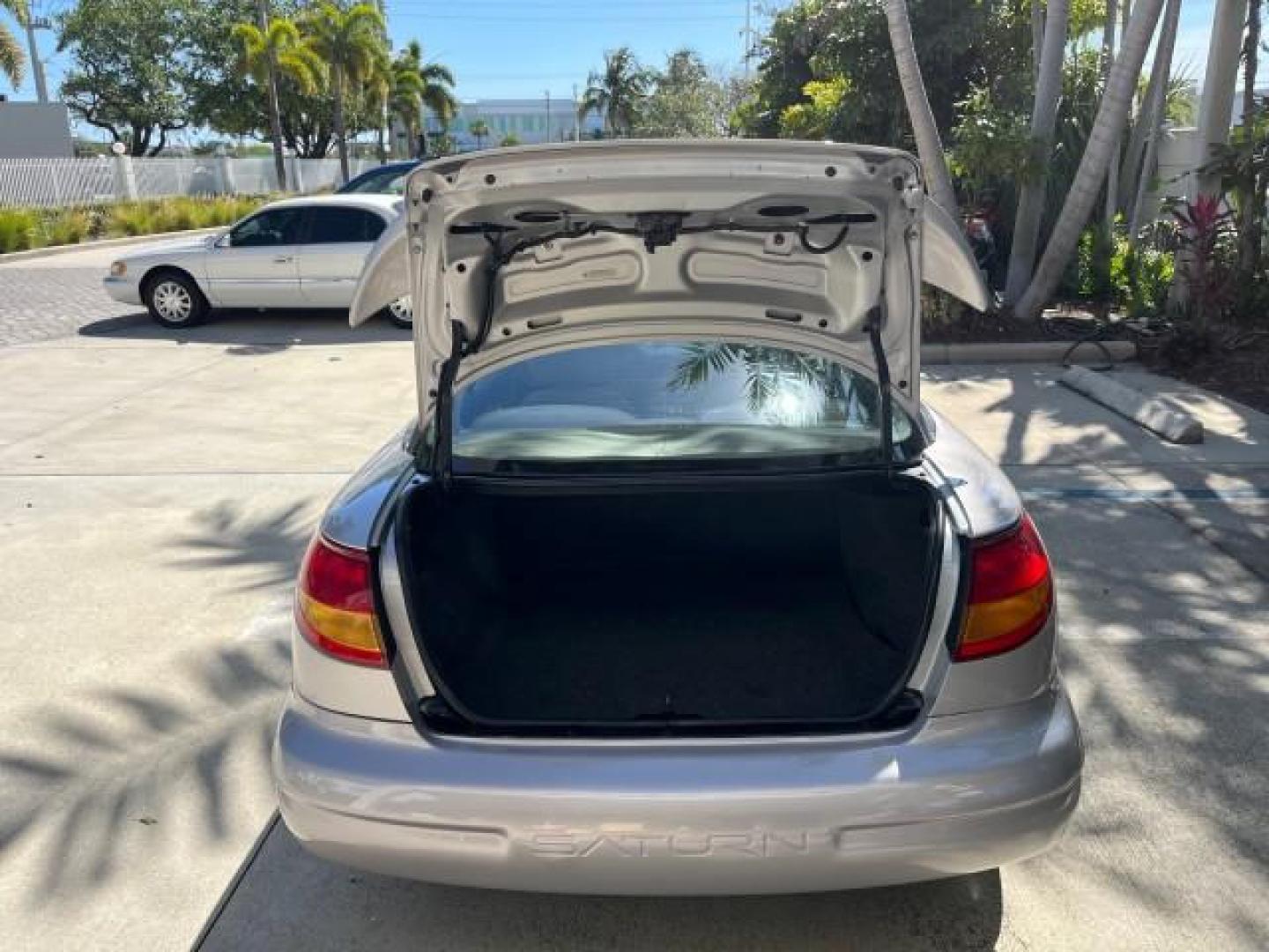 1999 Silver /Grey Saturn SC 3dr LOW MILES 53,616 (1G8ZY1276XZ) with an 1.9L DOHC SPFI 16-Valve L4 Aluminum Engine engine, Automatic transmission, located at 4701 North Dixie Hwy, Pompano Beach, FL, 33064, (954) 422-2889, 26.240938, -80.123474 - 1999 SATURN S-SERIES SC2 ROAD READY 1.9L L4 VIN: 1G8ZY1276XZ371017 NO RECALLS 36 MPG COUPE 3 DR LOW MILES 53,616 1.9L I4 F DOHC 16V 21 SERVICE RECORDS GASOLINE POWER SUNROOF FRONT WHEEL DRIVE POWER MIRRORS THIS IS ONE OF THE NICEST SATURN'S WE HAVE EVER LISTED RETIREE NORTH CAROLINA TITLE THIS IS TH - Photo#52