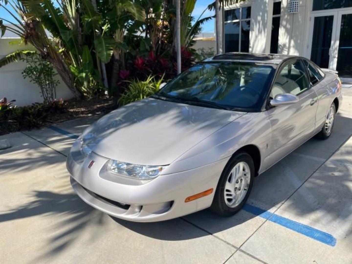 1999 Silver /Grey Saturn SC 3dr LOW MILES 53,616 (1G8ZY1276XZ) with an 1.9L DOHC SPFI 16-Valve L4 Aluminum Engine engine, Automatic transmission, located at 4701 North Dixie Hwy, Pompano Beach, FL, 33064, (954) 422-2889, 26.240938, -80.123474 - 1999 SATURN S-SERIES SC2 ROAD READY 1.9L L4 VIN: 1G8ZY1276XZ371017 NO RECALLS 36 MPG COUPE 3 DR LOW MILES 53,616 1.9L I4 F DOHC 16V 21 SERVICE RECORDS GASOLINE POWER SUNROOF FRONT WHEEL DRIVE POWER MIRRORS THIS IS ONE OF THE NICEST SATURN'S WE HAVE EVER LISTED RETIREE NORTH CAROLINA TITLE THIS IS TH - Photo#61