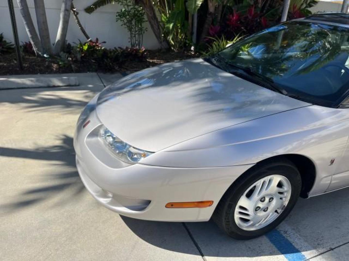 1999 Silver /Grey Saturn SC 3dr LOW MILES 53,616 (1G8ZY1276XZ) with an 1.9L DOHC SPFI 16-Valve L4 Aluminum Engine engine, Automatic transmission, located at 4701 North Dixie Hwy, Pompano Beach, FL, 33064, (954) 422-2889, 26.240938, -80.123474 - 1999 SATURN S-SERIES SC2 ROAD READY 1.9L L4 VIN: 1G8ZY1276XZ371017 NO RECALLS 36 MPG COUPE 3 DR LOW MILES 53,616 1.9L I4 F DOHC 16V 21 SERVICE RECORDS GASOLINE POWER SUNROOF FRONT WHEEL DRIVE POWER MIRRORS THIS IS ONE OF THE NICEST SATURN'S WE HAVE EVER LISTED RETIREE NORTH CAROLINA TITLE THIS IS TH - Photo#68