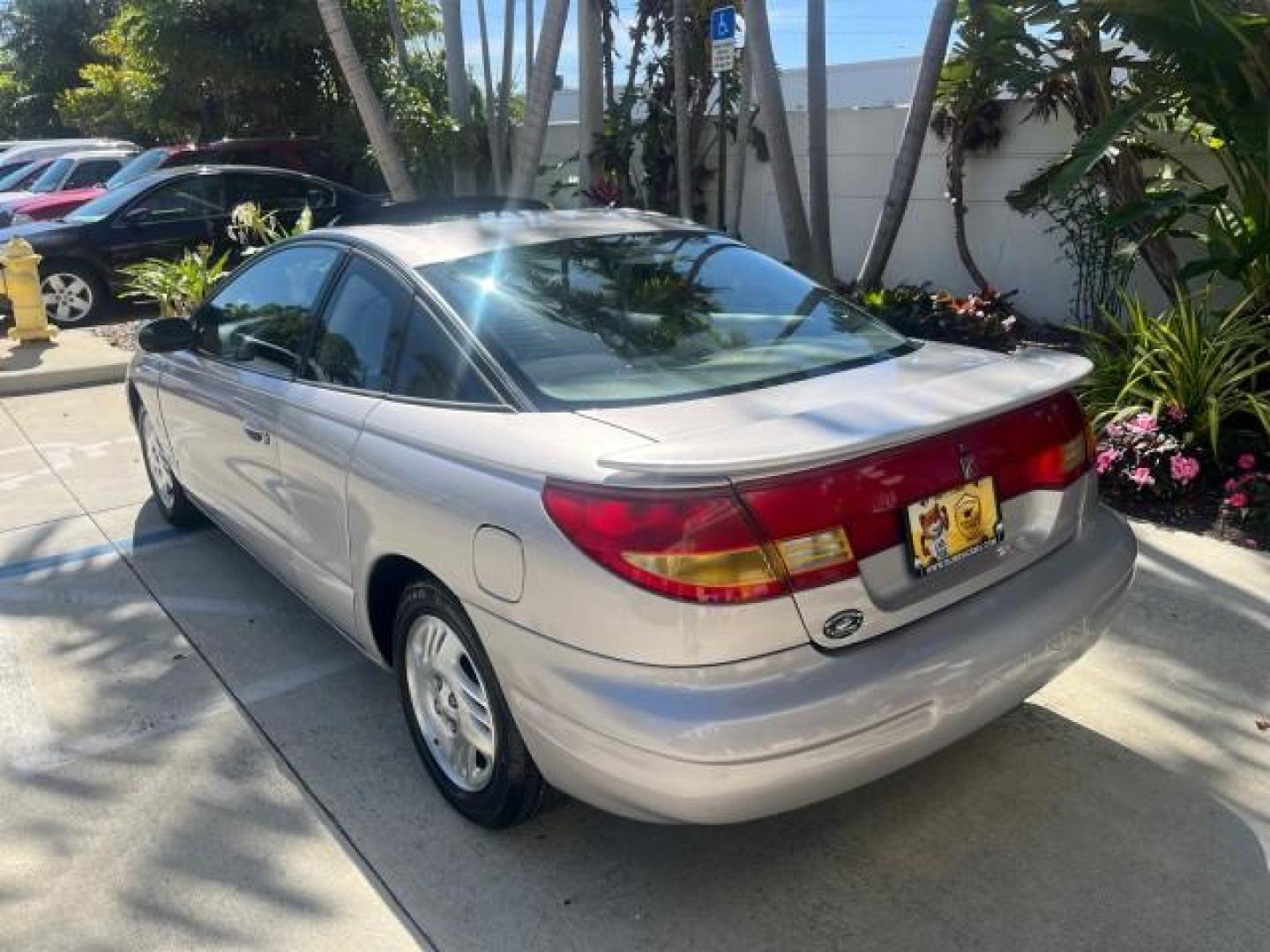 1999 Silver /Grey Saturn SC 3dr LOW MILES 53,616 (1G8ZY1276XZ) with an 1.9L DOHC SPFI 16-Valve L4 Aluminum Engine engine, Automatic transmission, located at 4701 North Dixie Hwy, Pompano Beach, FL, 33064, (954) 422-2889, 26.240938, -80.123474 - 1999 SATURN S-SERIES SC2 ROAD READY 1.9L L4 VIN: 1G8ZY1276XZ371017 NO RECALLS 36 MPG COUPE 3 DR LOW MILES 53,616 1.9L I4 F DOHC 16V 21 SERVICE RECORDS GASOLINE POWER SUNROOF FRONT WHEEL DRIVE POWER MIRRORS THIS IS ONE OF THE NICEST SATURN'S WE HAVE EVER LISTED RETIREE NORTH CAROLINA TITLE THIS IS TH - Photo#79