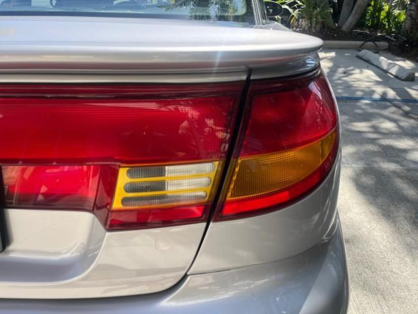 1999 Silver /Grey Saturn SC 3dr LOW MILES 53,616 (1G8ZY1276XZ) with an 1.9L DOHC SPFI 16-Valve L4 Aluminum Engine engine, Automatic transmission, located at 4701 North Dixie Hwy, Pompano Beach, FL, 33064, (954) 422-2889, 26.240938, -80.123474 - 1999 SATURN S-SERIES SC2 ROAD READY 1.9L L4 VIN: 1G8ZY1276XZ371017 NO RECALLS 36 MPG COUPE 3 DR LOW MILES 53,616 1.9L I4 F DOHC 16V 21 SERVICE RECORDS GASOLINE POWER SUNROOF FRONT WHEEL DRIVE POWER MIRRORS THIS IS ONE OF THE NICEST SATURN'S WE HAVE EVER LISTED RETIREE NORTH CAROLINA TITLE THIS IS TH - Photo#83