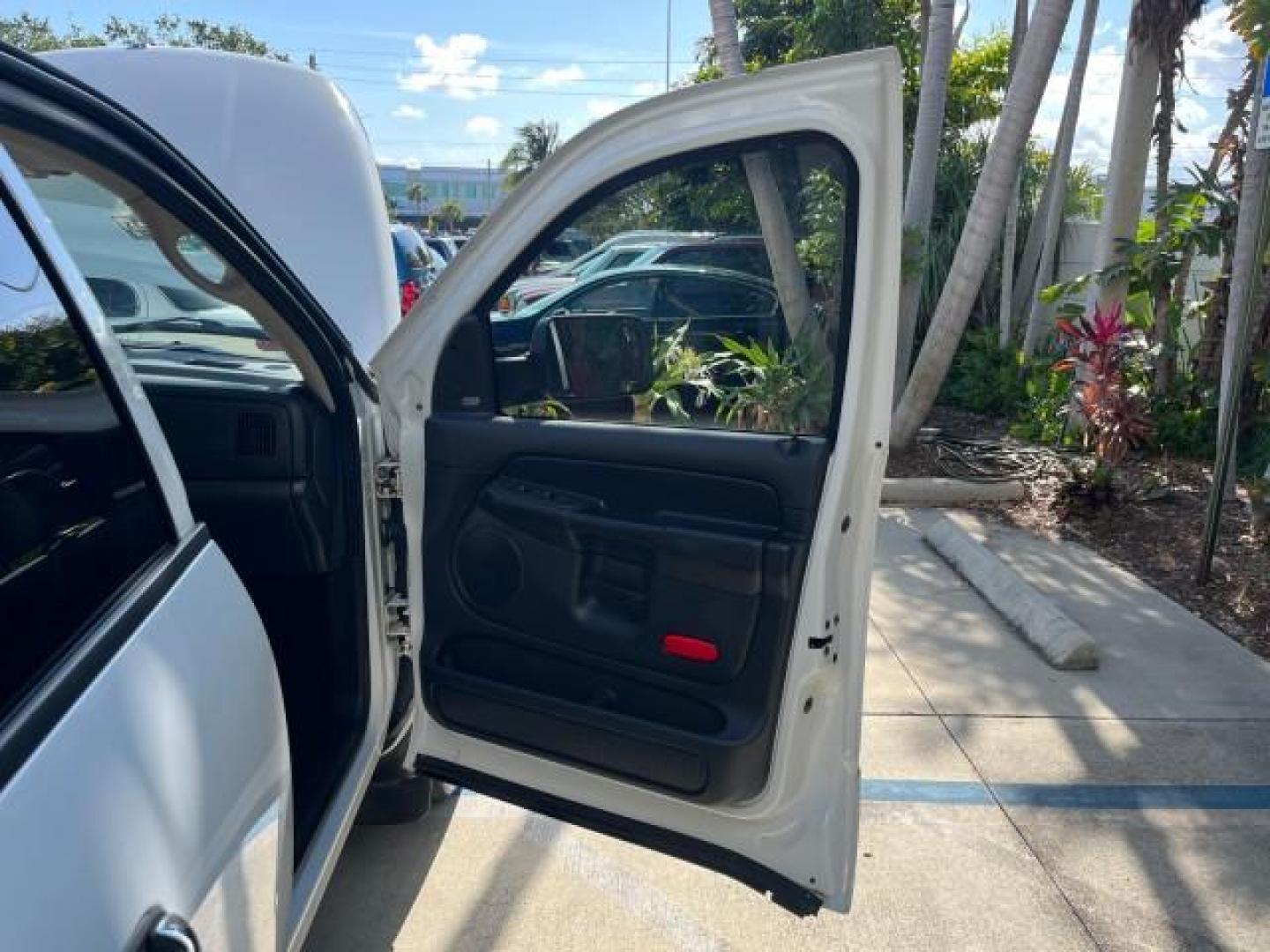 2004 Bright White /Dark Slate Gray Dodge Ram 1500 4 DR SLT V 8 LOW MILES (1D7HA18N44S) with an 4.7L V8 Magnum Engine engine, Automatic transmission, located at 4701 North Dixie Hwy, Pompano Beach, FL, 33064, (954) 422-2889, 26.240938, -80.123474 - OUR WEBPAGE FLORIDACARS1.COM HAS OVER 100 PHOTOS AND FREE CARFAX LINK 2004 DODGE RAM 1500 SLT ROAD READY 4.7L V8 VIN: 1D7HA18N44S753651 1 OWNER FLORIDA 4 DOOR EXTENDED CAB PICKUP LOW MILES 75,330 4.7L V8 F NO ACCIDENTS NO RECALLS GASOLINE POWER SEATS/MIRRORS REAR WHEEL DRIVE 6.4FT BED 18 SERVICE REC - Photo#11