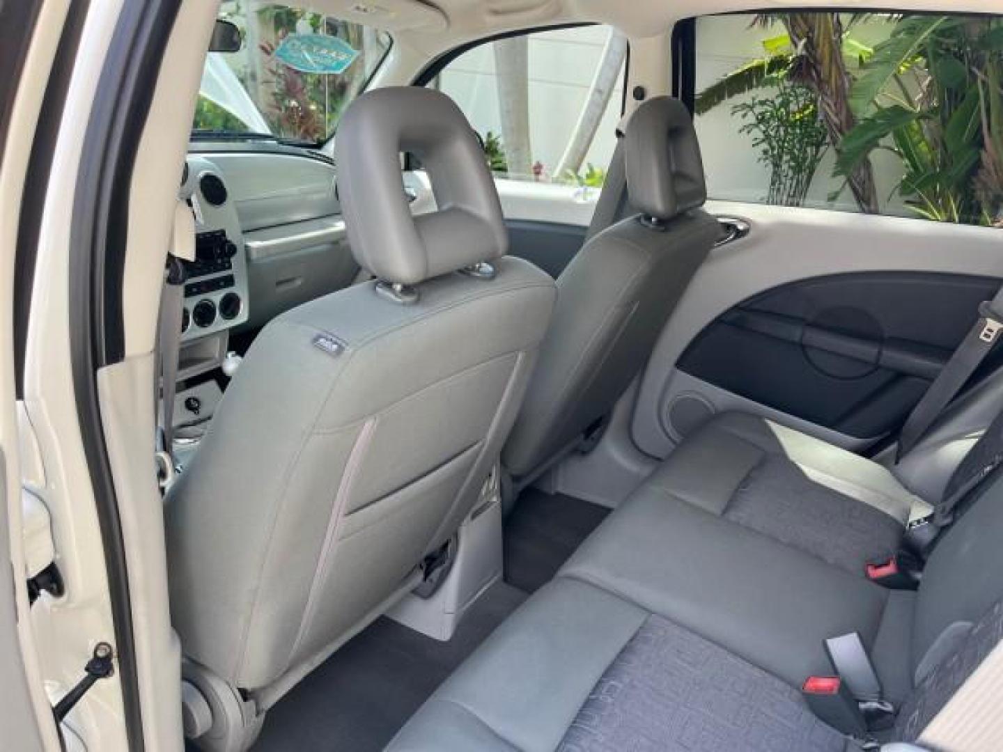 2010 Stone White /Pastel slate gray Chrysler PT Cruiser Classic LOW MILES 31,863 (3A4GY5F95AT) with an 2.4L DOHC SMPI 16-Valve I4 Engine engine, Automatic transmission, located at 4701 North Dixie Hwy, Pompano Beach, FL, 33064, (954) 422-2889, 26.240938, -80.123474 - 2010 CHRYSLER PT CRUISER ROAD READY 2.4L I4 VIN: 3A4GY5F95AT192153 NO ACCIDENTS NO RECALLS VAN FLORIDA OWNER 2.4L I4 F DOHC 16V 16 SERVICE RECORDS GASOLINE LOW MILES 31,863 FRONT WHEEL DRIVE Additional Airbags Alloy Wheels Anti-Theft System Chrome Grille Cruise Control Curtain Airbags Electronic Tra - Photo#37