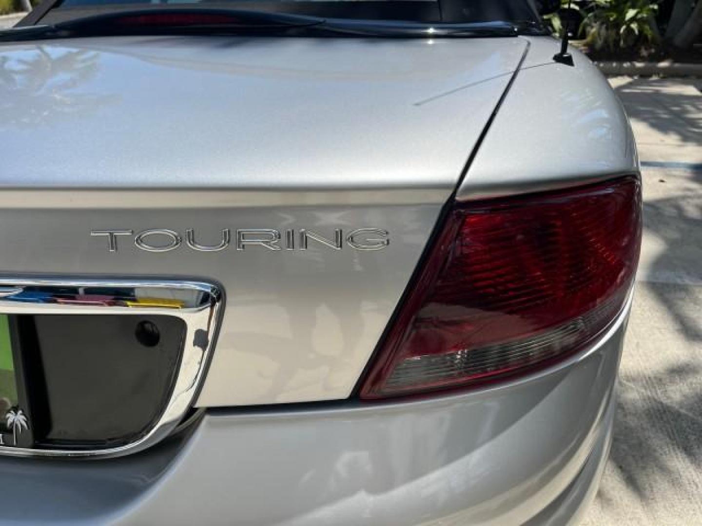 2005 Bright Silver Metallic /Dark Slate Gray Chrysler Sebring Conv Touring LOW MILES 26,922 (1C3EL55R75N) with an 2.7L DOHC SMPI 24-Valve V6 Engine engine, Automatic transmission, located at 4701 North Dixie Hwy, Pompano Beach, FL, 33064, (954) 422-2889, 26.240938, -80.123474 - OUR WEBPAGE FLORIDACARS1.COM HAS OVER 100 PHOTOS AND FREE CARFAX LINK 2005 CHRYSLER SEBRING TOURING ROAD READY 2.7L V6 VIN: 1C3EL55R75N653067 NO ACCIDENTS NO RECALLS CONVERTIBLE FLORIDA OWNER 28 MPG 2.7L V6 F DOHC 24V SUPER LOW MILES 26,922 GASOLINE POWER CONVERTIBLE TOP FRONT WHEEL DRIVE 7 SERVICE - Photo#89