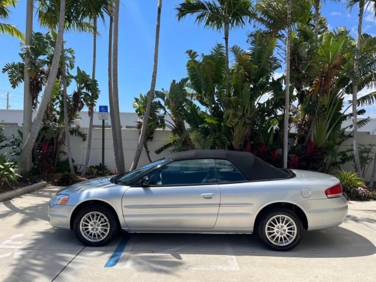 2005 Bright Silver Metallic /Dark Slate Gray Chrysler Sebring Conv Touring LOW MILES 26,922 (1C3EL55R75N) with an 2.7L DOHC SMPI 24-Valve V6 Engine engine, Automatic transmission, located at 4701 North Dixie Hwy, Pompano Beach, FL, 33064, (954) 422-2889, 26.240938, -80.123474 - OUR WEBPAGE FLORIDACARS1.COM HAS OVER 100 PHOTOS AND FREE CARFAX LINK 2005 CHRYSLER SEBRING TOURING ROAD READY 2.7L V6 VIN: 1C3EL55R75N653067 NO ACCIDENTS NO RECALLS CONVERTIBLE FLORIDA OWNER 28 MPG 2.7L V6 F DOHC 24V SUPER LOW MILES 26,922 GASOLINE POWER CONVERTIBLE TOP FRONT WHEEL DRIVE 7 SERVICE - Photo#4