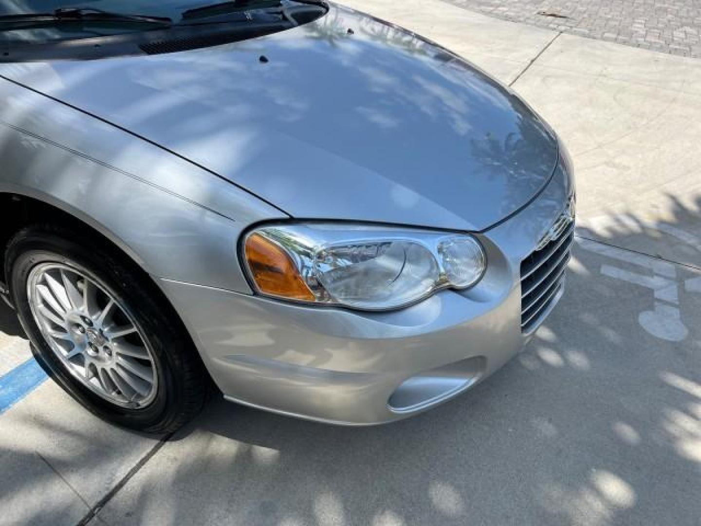 2005 Bright Silver Metallic /Dark Slate Gray Chrysler Sebring Conv Touring LOW MILES 26,922 (1C3EL55R75N) with an 2.7L DOHC SMPI 24-Valve V6 Engine engine, Automatic transmission, located at 4701 North Dixie Hwy, Pompano Beach, FL, 33064, (954) 422-2889, 26.240938, -80.123474 - OUR WEBPAGE FLORIDACARS1.COM HAS OVER 100 PHOTOS AND FREE CARFAX LINK 2005 CHRYSLER SEBRING TOURING ROAD READY 2.7L V6 VIN: 1C3EL55R75N653067 NO ACCIDENTS NO RECALLS CONVERTIBLE FLORIDA OWNER 28 MPG 2.7L V6 F DOHC 24V SUPER LOW MILES 26,922 GASOLINE POWER CONVERTIBLE TOP FRONT WHEEL DRIVE 7 SERVICE - Photo#72