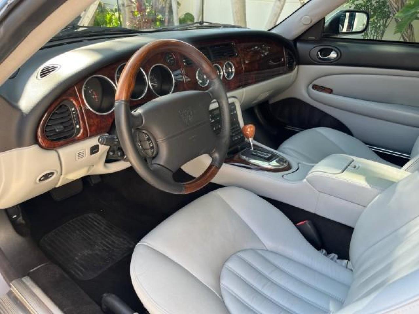 2005 Platinum /Charcoal Jaguar XK8 CONV LOW MILES 22,262 (SAJDA42C852) with an 4.2L DOHC EFI 32-Valve Aluminum Alloy V8 Engine engine, Automatic transmission, located at 4701 North Dixie Hwy, Pompano Beach, FL, 33064, (954) 422-2889, 26.240938, -80.123474 - 2005 JAGUAR XK-SERIES XK8 NEW $76,030 ROAD READY VIN: SAJDA42C852A44308 NO RECALLS 4.2L V8 CONVERTIBLE FLORIDA OWNER 4.2L V8 F DOHC POWER CONVERTIBLE TOP GASOLINE 9 SERVICE RECORDS POWER LEATHER SEATS REAR WHEEL DRIVE SUPER LOW MILES 22,262 PARKING SENSORS Alloy Wheels Anti-Theft System Auto-dimming - Photo#30