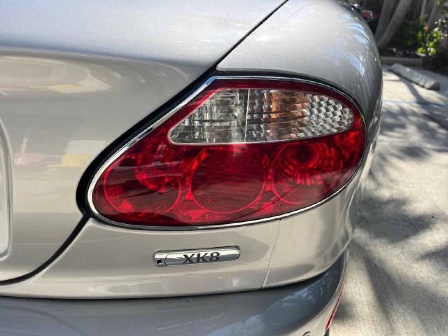 2005 Platinum /Charcoal Jaguar XK8 CONV LOW MILES 22,262 (SAJDA42C852) with an 4.2L DOHC EFI 32-Valve Aluminum Alloy V8 Engine engine, Automatic transmission, located at 4701 North Dixie Hwy, Pompano Beach, FL, 33064, (954) 422-2889, 26.240938, -80.123474 - 2005 JAGUAR XK-SERIES XK8 NEW $76,030 ROAD READY VIN: SAJDA42C852A44308 NO RECALLS 4.2L V8 CONVERTIBLE FLORIDA OWNER 4.2L V8 F DOHC POWER CONVERTIBLE TOP GASOLINE 9 SERVICE RECORDS POWER LEATHER SEATS REAR WHEEL DRIVE SUPER LOW MILES 22,262 PARKING SENSORS Alloy Wheels Anti-Theft System Auto-dimming - Photo#97