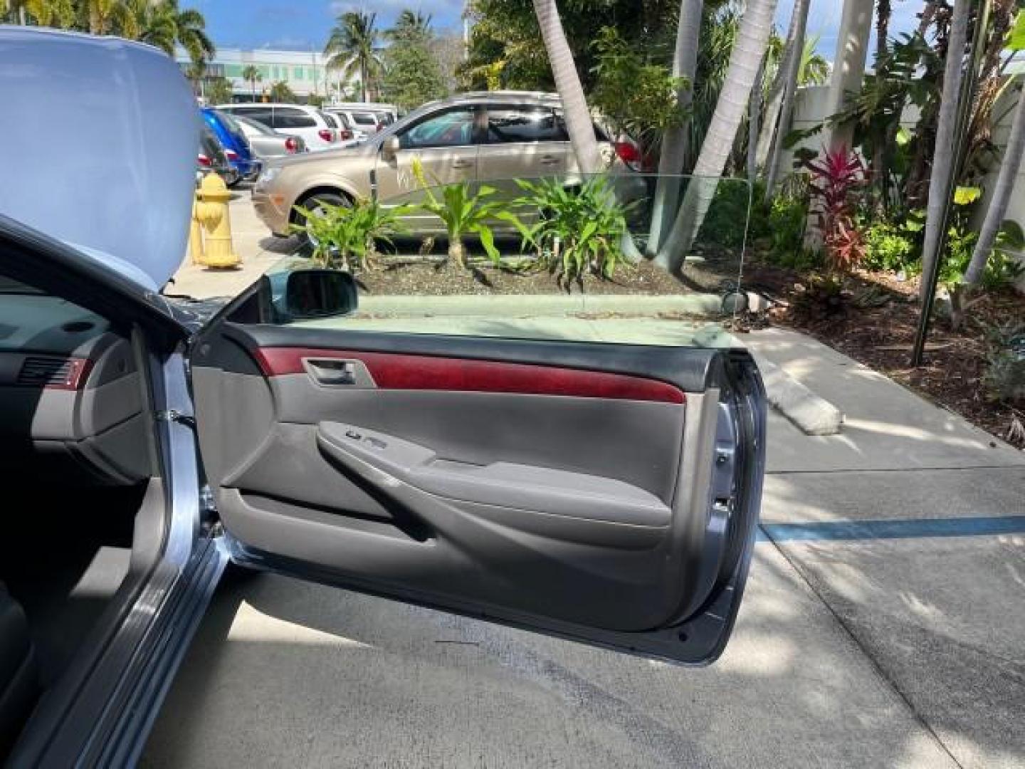 2005 Cosmic Blue Metallic /Ivory Toyota Camry Solara LOW MILES 69,408 SLE (4T1FA38P85U) with an 3.3L DOHC SEFI VVT-i 24-Valve V6 Engine engine, Automatic transmission, located at 4701 North Dixie Hwy, Pompano Beach, FL, 33064, (954) 422-2889, 26.240938, -80.123474 - 2005 TOYOTA CAMRY SOLARA SE V6 ROAD READY 3.3L V6 VIN: 4T1FA38P85U054152 POWER CONVERTIBLE TOP CONVERTIBLE POWER LEATHER SEATS 3.3L V6 F DOHC 24V 29 SERVICE RECORDS GASOLINE FLORIDA OWNER 31 MPG FRONT WHEEL DRIVE LOW MILES 69,408 NO ACCIDENTS NO RECALLS Alloy Wheels Automatic Climate Control Cruise - Photo#12