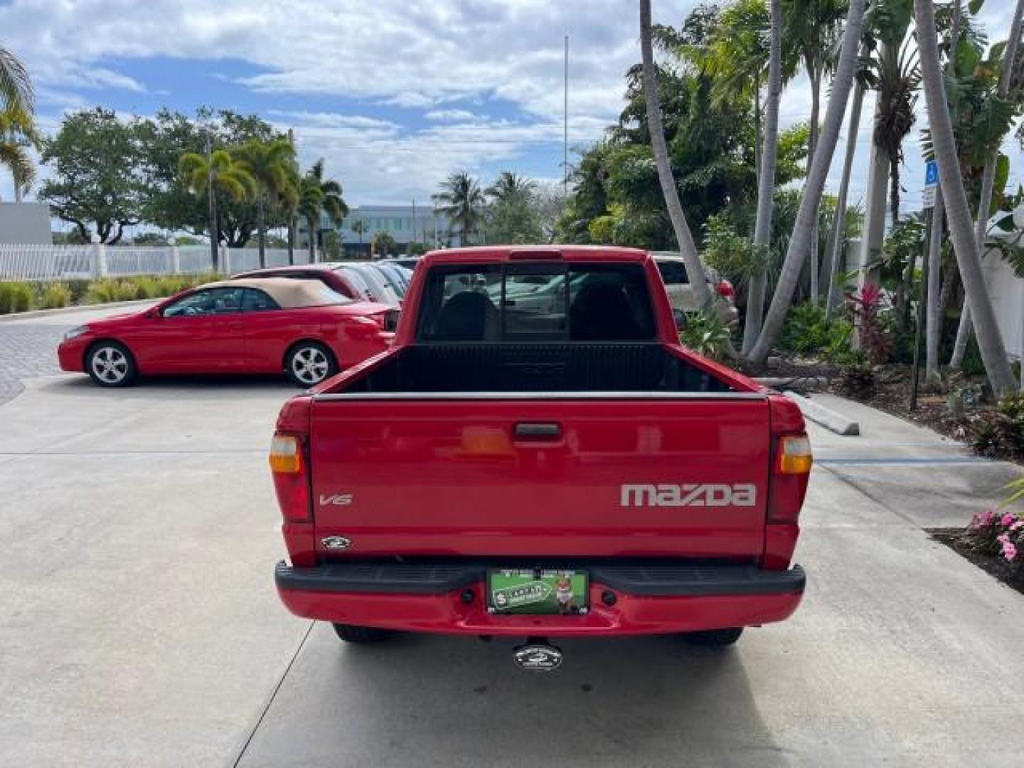 2002 Performance Red Metallic /Medium Graphite Mazda B-Series 2WD Truck DS LOW MILES 80,576 (4F4YR12U02T) with an 3.0L MFI V6 Engine engine, Automatic transmission, located at 4701 North Dixie Hwy, Pompano Beach, FL, 33064, (954) 422-2889, 26.240938, -80.123474 - 2002 MAZDA B-SERIES B3000 DUAL SPORT AUTO ROAD READY WORK READY VIN: 4F4YR12U02TM07288 NO ACCIDENTS PICKUP NO RECALLS 3.0L V6 F LOW MILES 80,576 GASOLINE POWER MIRRORS 35 SERVICE RECORDS REAR WHEEL DRIVE BACK UP CAMERA 6 FT BED 3.0L V6 6.0' Bed Length Alloy Wheels Anti-Theft System Fog Lights RWD Re - Photo#6