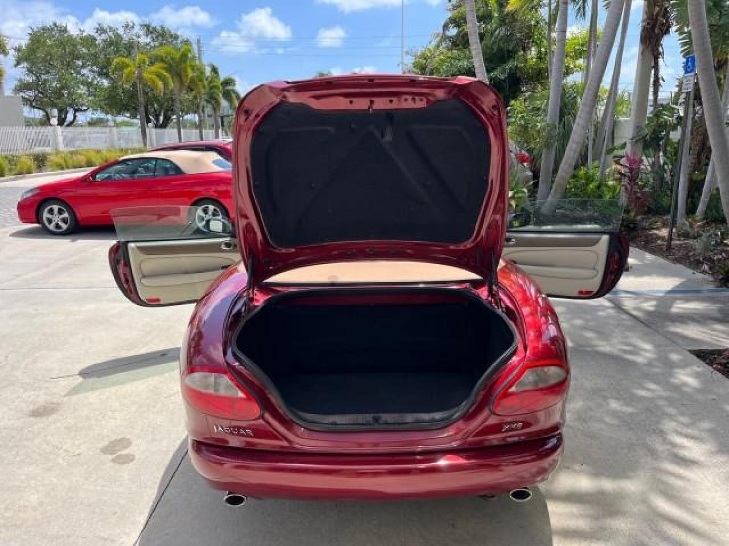 1999 Carnival Red /Oatmeal Jaguar XK8 LOW MILES 25,299 (SAJGX204XXC) with an 4.0L DOHC SPFI 32-Valve V8 Aluminum Alloy Engine engine, Automatic transmission, located at 4701 North Dixie Hwy, Pompano Beach, FL, 33064, (954) 422-2889, 26.240938, -80.123474 - 1999 JAGUAR XK-SERIES XK8 NEW $73,550 ROAD READY VIN: SAJGX204XXC033817 NO ACCIDENTS NO RECALLS CONVERTIBLE FLORIDA OWNER 4.OL V8 4.0L V8 F DOHC 24V LOW MILES 25,299 GASOLINE POWER CONVERTIBLE TOP REAR WHEEL DRIVE 14 SERVICE RECORDS POWER LEATHER SEATS Alloy Wheels Memory Seat(s) Leather Seats Soft - Photo#15