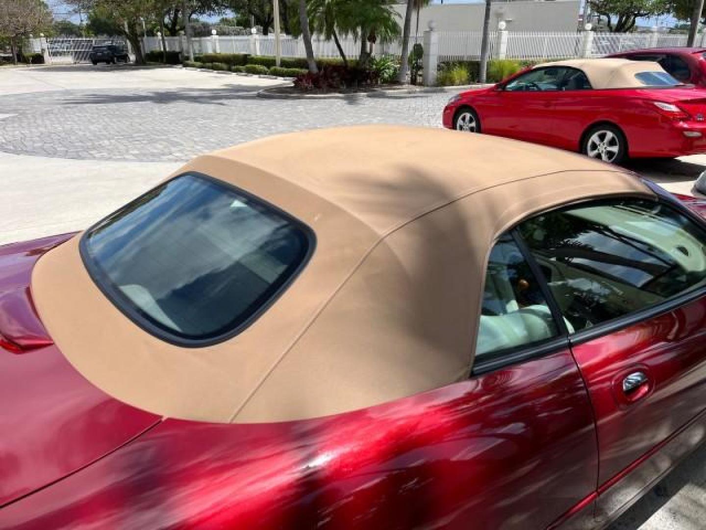 1999 Carnival Red /Oatmeal Jaguar XK8 LOW MILES 25,299 (SAJGX204XXC) with an 4.0L DOHC SPFI 32-Valve V8 Aluminum Alloy Engine engine, Automatic transmission, located at 4701 North Dixie Hwy, Pompano Beach, FL, 33064, (954) 422-2889, 26.240938, -80.123474 - 1999 JAGUAR XK-SERIES XK8 NEW $73,550 ROAD READY VIN: SAJGX204XXC033817 NO ACCIDENTS NO RECALLS CONVERTIBLE FLORIDA OWNER 4.OL V8 4.0L V8 F DOHC 24V LOW MILES 25,299 GASOLINE POWER CONVERTIBLE TOP REAR WHEEL DRIVE 14 SERVICE RECORDS POWER LEATHER SEATS Alloy Wheels Memory Seat(s) Leather Seats Soft - Photo#90