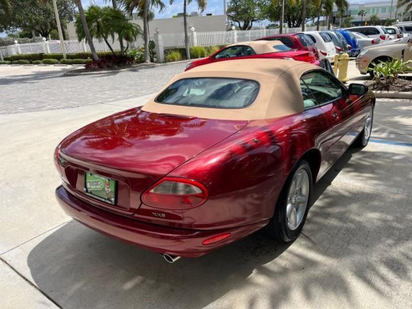 1999 Carnival Red /Oatmeal Jaguar XK8 LOW MILES 25,299 (SAJGX204XXC) with an 4.0L DOHC SPFI 32-Valve V8 Aluminum Alloy Engine engine, Automatic transmission, located at 4701 North Dixie Hwy, Pompano Beach, FL, 33064, (954) 422-2889, 26.240938, -80.123474 - 1999 JAGUAR XK-SERIES XK8 NEW $73,550 ROAD READY VIN: SAJGX204XXC033817 NO ACCIDENTS NO RECALLS CONVERTIBLE FLORIDA OWNER 4.OL V8 4.0L V8 F DOHC 24V LOW MILES 25,299 GASOLINE POWER CONVERTIBLE TOP REAR WHEEL DRIVE 14 SERVICE RECORDS POWER LEATHER SEATS Alloy Wheels Memory Seat(s) Leather Seats Soft - Photo#93