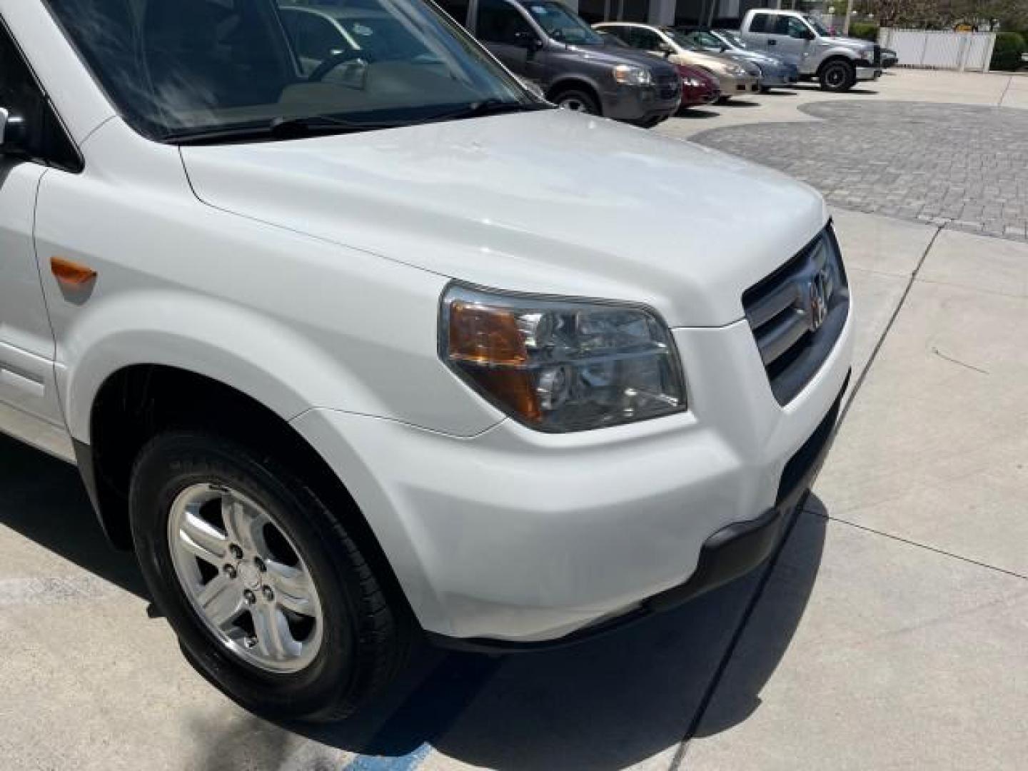 2007 Taffeta White /Saddle Honda Pilot EX LOW MILES 65,235 (5FNYF28417B) with an 3.5L SOHC MPFI 24-Valve i-VTEC V6 Engine engine, Automatic transmission, located at 4701 North Dixie Hwy, Pompano Beach, FL, 33064, (954) 422-2889, 26.240938, -80.123474 - OUR WEBPAGE FLORIDACARS1.COM HAS OVER 100 PHOTOS AND FREE CARFAX LINK 2007 HONDA PILOT EX ROAD READY 3.5L V6 VIN: 5FNYF28417B023674 NO ACCIDENTS 4 DOOR WAGON/SPORT UTILITY NO RECALLS 3.5L V6 F SOHC LOW MILES 65,235 GASOLINE POWER SEARS/MIRRORS 8 SERVICE RECORDS FRONT WHEEL DRIVE FLORIDA OWNER 3 ROW - Photo#74