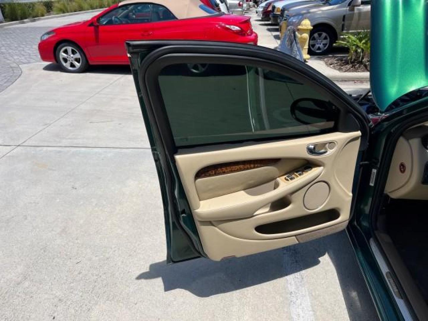 2006 Jaguar Racing Green /Ivory Jaguar X-TYPE AWD LOW MILES 61,609 (SAJWA51A56W) with an 3.0L DOHC SMPI 24-Valve V6 Engine engine, Automatic transmission, located at 4701 North Dixie Hwy, Pompano Beach, FL, 33064, (954) 422-2889, 26.240938, -80.123474 - OUR WEBPAGE FLORIDACARS1.COM HAS OVER 100 PHOTOS AND FREE CARFAX LINK 2006 JAGUAR X-TYPE 3.0L NEW $40,855 ROAD READY VIN: SAJWA51A56WE96399 NO ACCIDENTS NO RECALLS SEDAN 4 DR FLORIDA OWNER 3.0L V6 3.0L V6 F DOHC PARK SENSORS POWER LEATHER SEATS GASOLINE 7 SERVICE RECORDS POWER SUNROOF/MIRRORS ALL WH - Photo#9