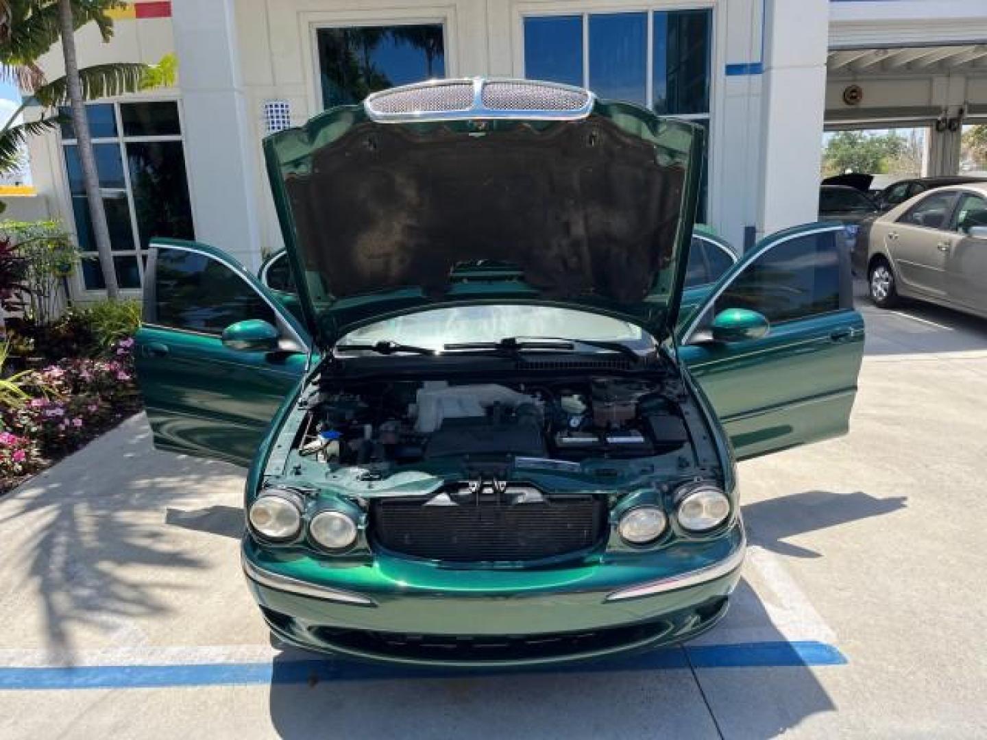 2006 Jaguar Racing Green /Ivory Jaguar X-TYPE AWD LOW MILES 61,609 (SAJWA51A56W) with an 3.0L DOHC SMPI 24-Valve V6 Engine engine, Automatic transmission, located at 4701 North Dixie Hwy, Pompano Beach, FL, 33064, (954) 422-2889, 26.240938, -80.123474 - OUR WEBPAGE FLORIDACARS1.COM HAS OVER 100 PHOTOS AND FREE CARFAX LINK 2006 JAGUAR X-TYPE 3.0L NEW $40,855 ROAD READY VIN: SAJWA51A56WE96399 NO ACCIDENTS NO RECALLS SEDAN 4 DR FLORIDA OWNER 3.0L V6 3.0L V6 F DOHC PARK SENSORS POWER LEATHER SEATS GASOLINE 7 SERVICE RECORDS POWER SUNROOF/MIRRORS ALL WH - Photo#16