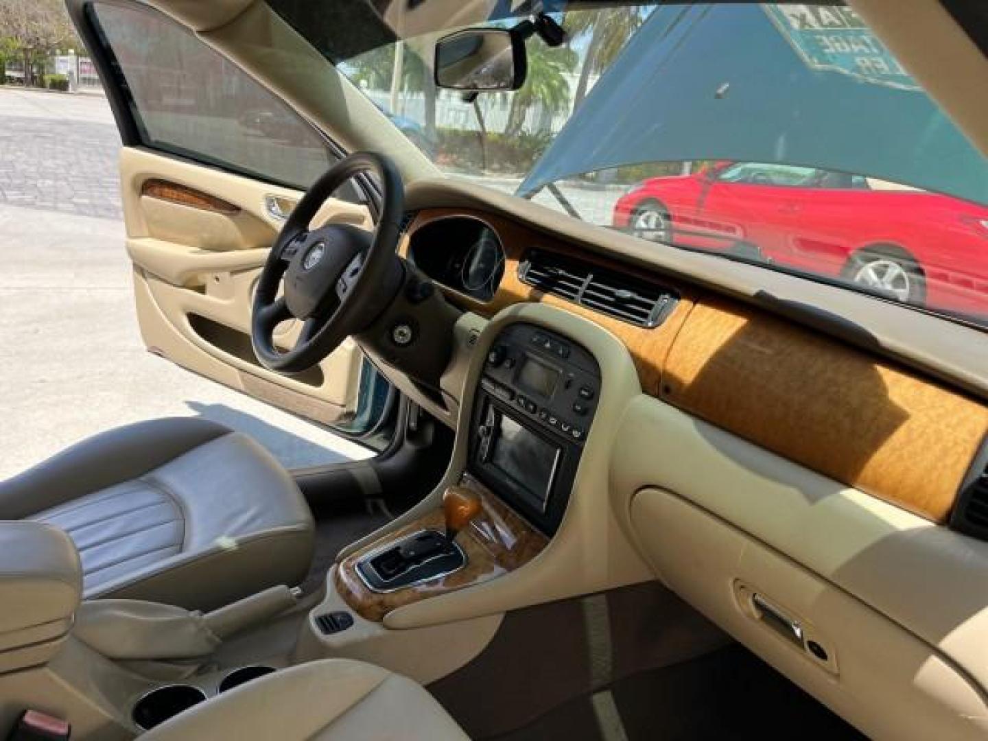 2006 Jaguar Racing Green /Ivory Jaguar X-TYPE AWD LOW MILES 61,609 (SAJWA51A56W) with an 3.0L DOHC SMPI 24-Valve V6 Engine engine, Automatic transmission, located at 4701 North Dixie Hwy, Pompano Beach, FL, 33064, (954) 422-2889, 26.240938, -80.123474 - OUR WEBPAGE FLORIDACARS1.COM HAS OVER 100 PHOTOS AND FREE CARFAX LINK 2006 JAGUAR X-TYPE 3.0L NEW $40,855 ROAD READY VIN: SAJWA51A56WE96399 NO ACCIDENTS NO RECALLS SEDAN 4 DR FLORIDA OWNER 3.0L V6 3.0L V6 F DOHC PARK SENSORS POWER LEATHER SEATS GASOLINE 7 SERVICE RECORDS POWER SUNROOF/MIRRORS ALL WH - Photo#25
