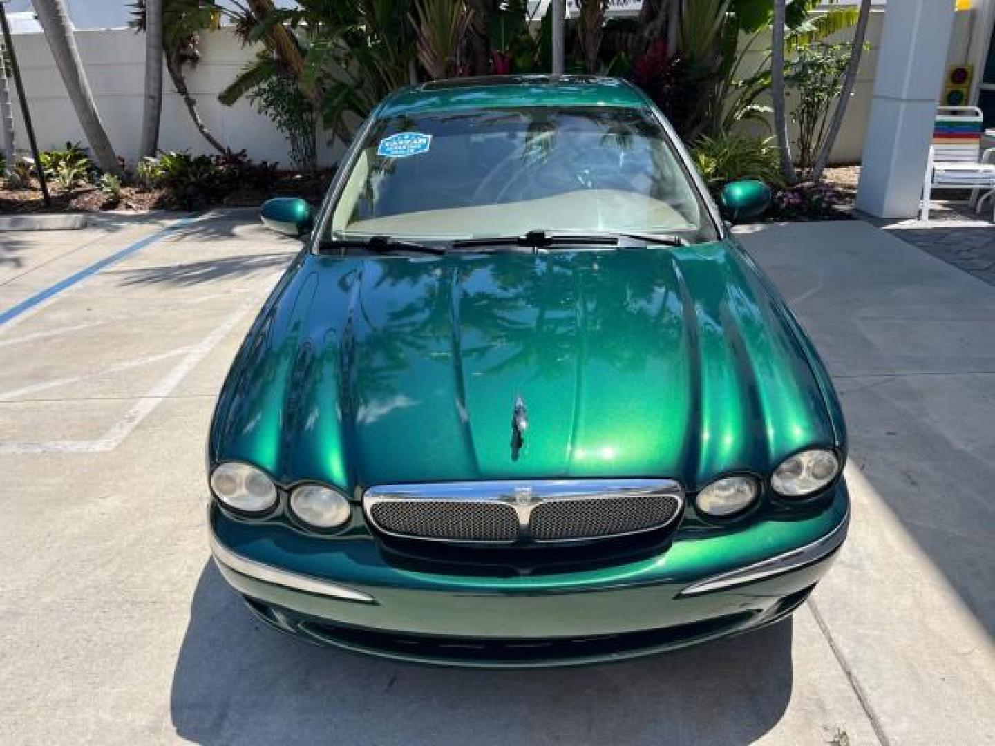 2006 Jaguar Racing Green /Ivory Jaguar X-TYPE AWD LOW MILES 61,609 (SAJWA51A56W) with an 3.0L DOHC SMPI 24-Valve V6 Engine engine, Automatic transmission, located at 4701 North Dixie Hwy, Pompano Beach, FL, 33064, (954) 422-2889, 26.240938, -80.123474 - OUR WEBPAGE FLORIDACARS1.COM HAS OVER 100 PHOTOS AND FREE CARFAX LINK 2006 JAGUAR X-TYPE 3.0L NEW $40,855 ROAD READY VIN: SAJWA51A56WE96399 NO ACCIDENTS NO RECALLS SEDAN 4 DR FLORIDA OWNER 3.0L V6 3.0L V6 F DOHC PARK SENSORS POWER LEATHER SEATS GASOLINE 7 SERVICE RECORDS POWER SUNROOF/MIRRORS ALL WH - Photo#2