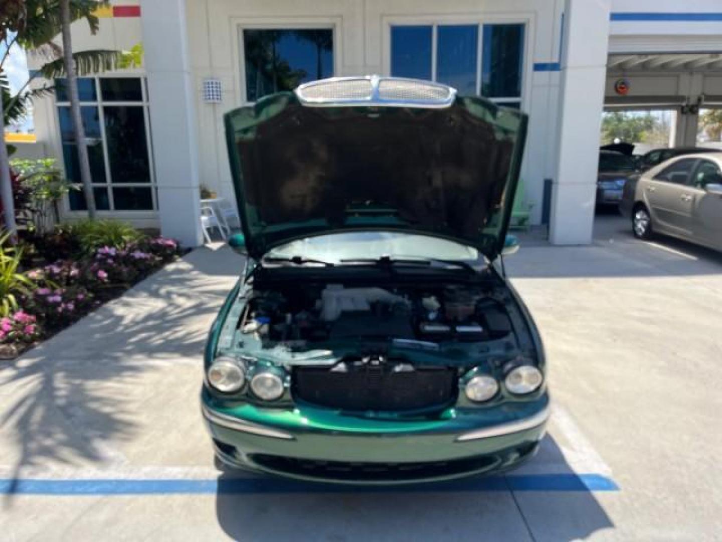 2006 Jaguar Racing Green /Ivory Jaguar X-TYPE AWD LOW MILES 61,609 (SAJWA51A56W) with an 3.0L DOHC SMPI 24-Valve V6 Engine engine, Automatic transmission, located at 4701 North Dixie Hwy, Pompano Beach, FL, 33064, (954) 422-2889, 26.240938, -80.123474 - OUR WEBPAGE FLORIDACARS1.COM HAS OVER 100 PHOTOS AND FREE CARFAX LINK 2006 JAGUAR X-TYPE 3.0L NEW $40,855 ROAD READY VIN: SAJWA51A56WE96399 NO ACCIDENTS NO RECALLS SEDAN 4 DR FLORIDA OWNER 3.0L V6 3.0L V6 F DOHC PARK SENSORS POWER LEATHER SEATS GASOLINE 7 SERVICE RECORDS POWER SUNROOF/MIRRORS ALL WH - Photo#51