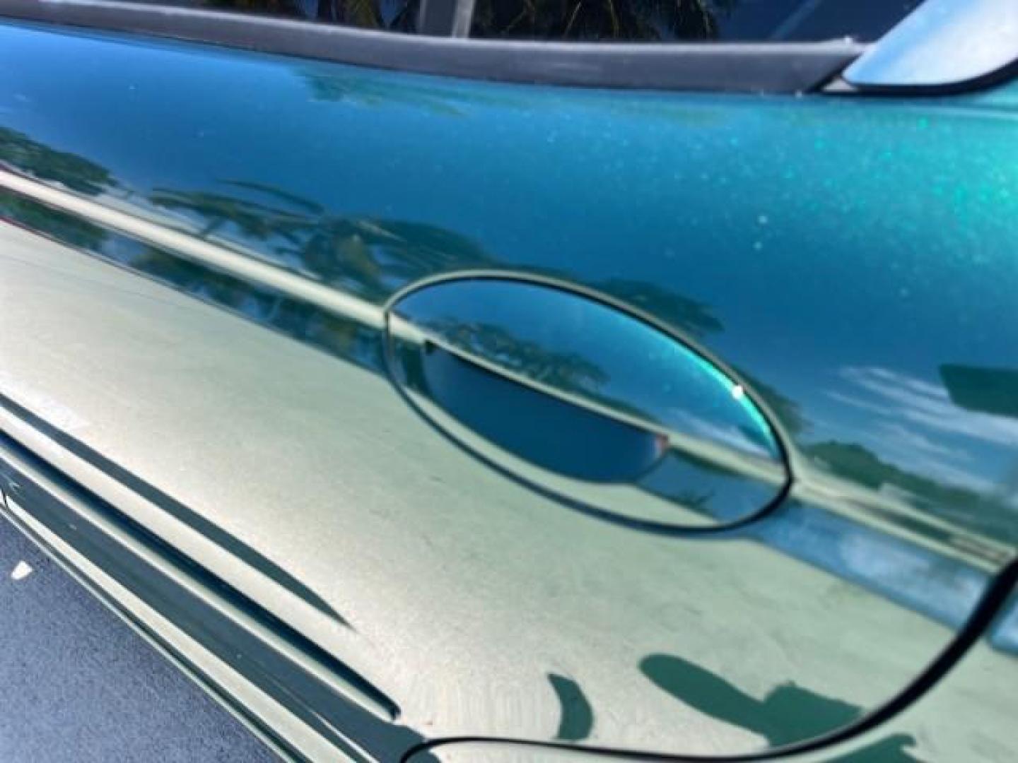 2006 Jaguar Racing Green /Ivory Jaguar X-TYPE AWD LOW MILES 61,609 (SAJWA51A56W) with an 3.0L DOHC SMPI 24-Valve V6 Engine engine, Automatic transmission, located at 4701 North Dixie Hwy, Pompano Beach, FL, 33064, (954) 422-2889, 26.240938, -80.123474 - OUR WEBPAGE FLORIDACARS1.COM HAS OVER 100 PHOTOS AND FREE CARFAX LINK 2006 JAGUAR X-TYPE 3.0L NEW $40,855 ROAD READY VIN: SAJWA51A56WE96399 NO ACCIDENTS NO RECALLS SEDAN 4 DR FLORIDA OWNER 3.0L V6 3.0L V6 F DOHC PARK SENSORS POWER LEATHER SEATS GASOLINE 7 SERVICE RECORDS POWER SUNROOF/MIRRORS ALL WH - Photo#69