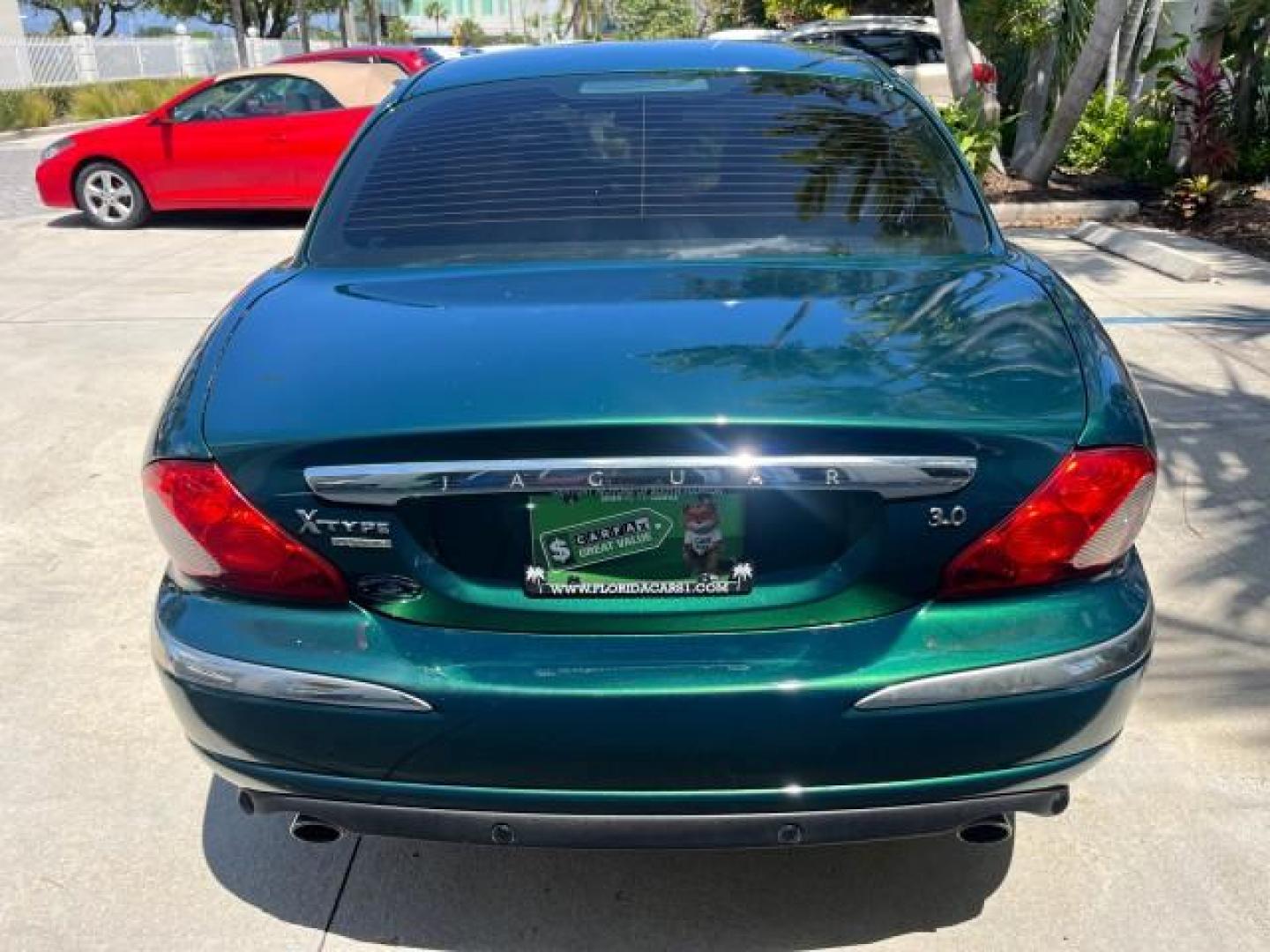 2006 Jaguar Racing Green /Ivory Jaguar X-TYPE AWD LOW MILES 61,609 (SAJWA51A56W) with an 3.0L DOHC SMPI 24-Valve V6 Engine engine, Automatic transmission, located at 4701 North Dixie Hwy, Pompano Beach, FL, 33064, (954) 422-2889, 26.240938, -80.123474 - OUR WEBPAGE FLORIDACARS1.COM HAS OVER 100 PHOTOS AND FREE CARFAX LINK 2006 JAGUAR X-TYPE 3.0L NEW $40,855 ROAD READY VIN: SAJWA51A56WE96399 NO ACCIDENTS NO RECALLS SEDAN 4 DR FLORIDA OWNER 3.0L V6 3.0L V6 F DOHC PARK SENSORS POWER LEATHER SEATS GASOLINE 7 SERVICE RECORDS POWER SUNROOF/MIRRORS ALL WH - Photo#86