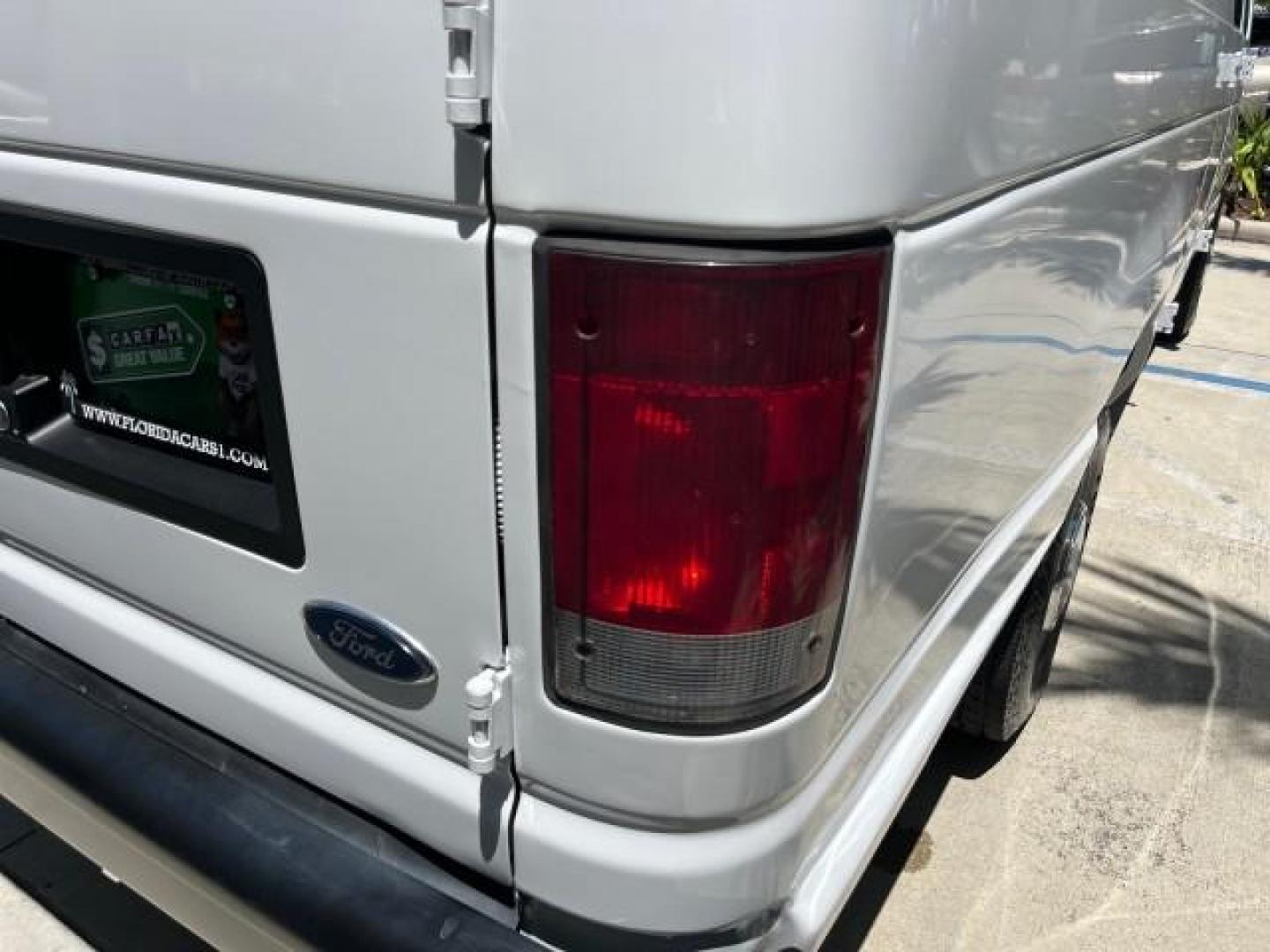 2003 Oxford White /Medium Flint Ford Econoline Cargo Van EXT Super LOW MILES 68,688 (1FTNS24223H) with an 4.2L EFI V6 Engine engine, Automatic transmission, located at 4701 North Dixie Hwy, Pompano Beach, FL, 33064, (954) 422-2889, 26.240938, -80.123474 - OUR WEBPAGE FLORIDACARS1.COM HAS OVER 100 PHOTOS AND FREE CARFAX LINK 2003 FORD E-SERIES E-250 ROAD READY WORK READY VIN: 1FTNS24223HB96651 NO RECALLS 4.2L V6 VAN LOW MILES 68,684 4.2L V6 F SOHC 10 SERVICE RECORDS GASOLINE REAR WHEEL DRIVE Front Bucket Seats RWD THIS IS ONE OF THE NICEST FORD VANS W - Photo#85