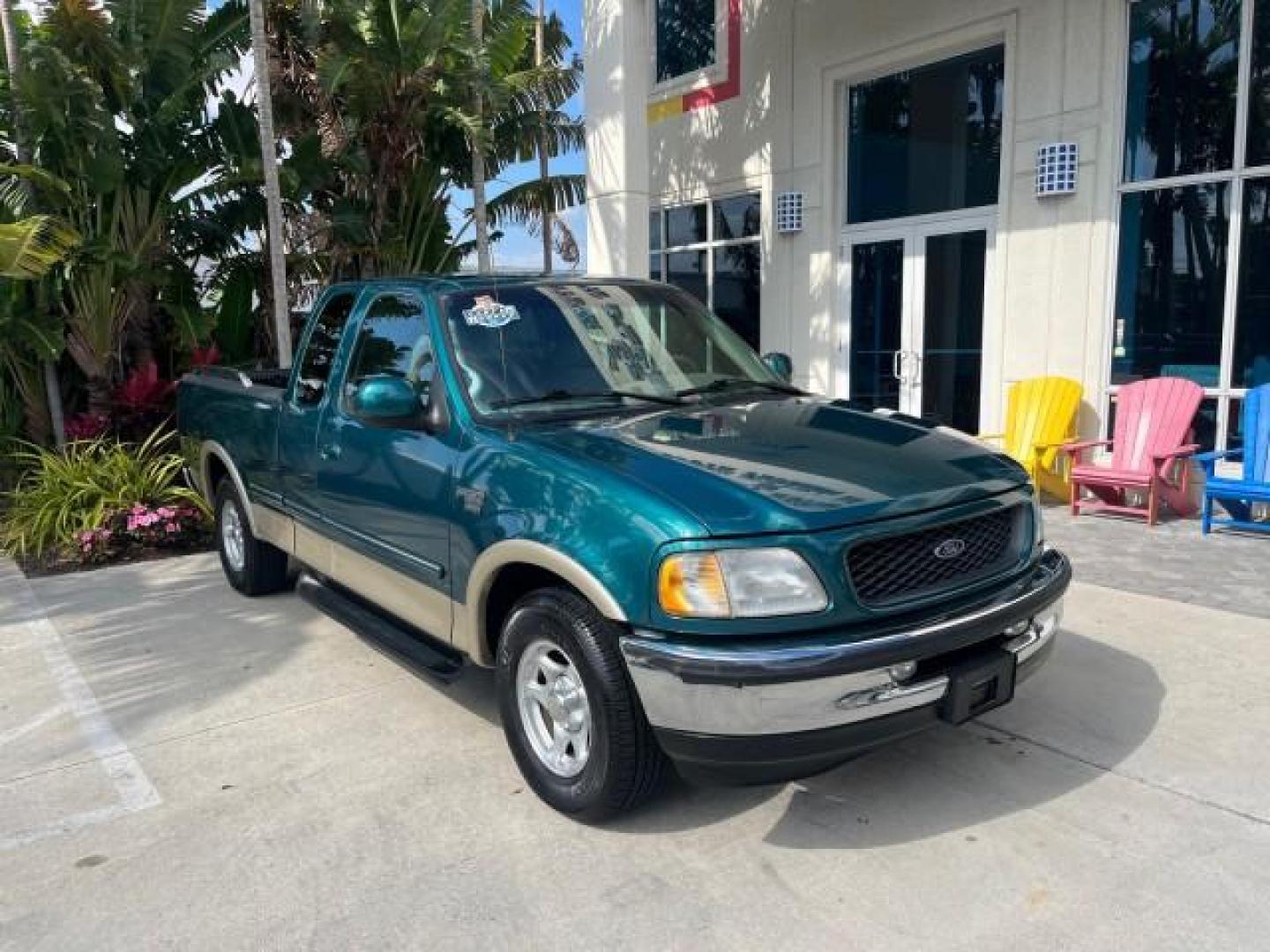 1998 Pacific Green (CC/Met) /Medium Prarie Tan Ford F-150 1 FL Lariat LOW MILES 78,833 (1FTZX1763WN) with an 4.6L EFI OHC V8 Triton Engine engine, Automatic transmission, located at 4701 North Dixie Hwy, Pompano Beach, FL, 33064, (954) 422-2889, 26.240938, -80.123474 - 1998 FORD F-150 ROAD READY 4.6L V8 VIN: 1FTZX1763WNB09132 1 OWNER FLORIDA 3 DOOR EXTENDED CAB PICKUP NO RECALLS 4.6L V8 F LOW MILES 78,833 GASOLINE 6.6 FT BED POWER LEATHER SEATS REAR WHEEL DRIVE POWER MIRRORS 8 SERVICE RECORDS THIS IS ONE OF THE NICEST FORD F-150 WE HAVE EVER LISTED RETIREE FLORIDA - Photo#1