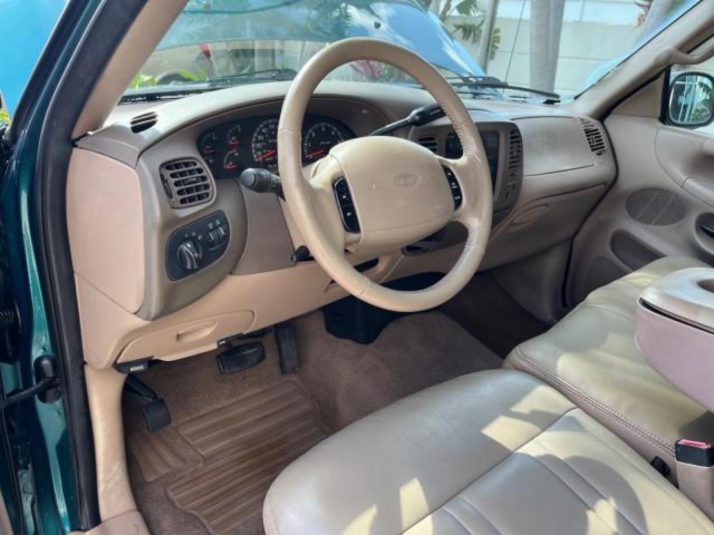 1998 Pacific Green (CC/Met) /Medium Prarie Tan Ford F-150 1 FL Lariat LOW MILES 78,833 (1FTZX1763WN) with an 4.6L EFI OHC V8 Triton Engine engine, Automatic transmission, located at 4701 North Dixie Hwy, Pompano Beach, FL, 33064, (954) 422-2889, 26.240938, -80.123474 - 1998 FORD F-150 ROAD READY 4.6L V8 VIN: 1FTZX1763WNB09132 1 OWNER FLORIDA 3 DOOR EXTENDED CAB PICKUP NO RECALLS 4.6L V8 F LOW MILES 78,833 GASOLINE 6.6 FT BED POWER LEATHER SEATS REAR WHEEL DRIVE POWER MIRRORS 8 SERVICE RECORDS THIS IS ONE OF THE NICEST FORD F-150 WE HAVE EVER LISTED RETIREE FLORIDA - Photo#31