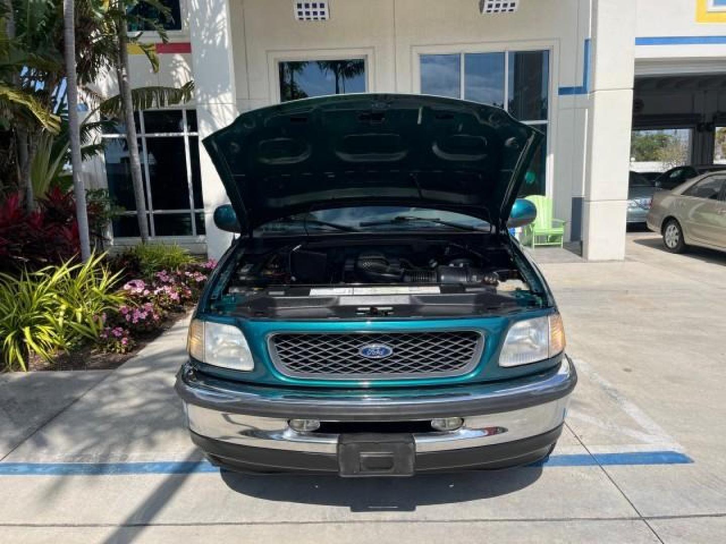 1998 Pacific Green (CC/Met) /Medium Prarie Tan Ford F-150 1 FL Lariat LOW MILES 78,833 (1FTZX1763WN) with an 4.6L EFI OHC V8 Triton Engine engine, Automatic transmission, located at 4701 North Dixie Hwy, Pompano Beach, FL, 33064, (954) 422-2889, 26.240938, -80.123474 - 1998 FORD F-150 ROAD READY 4.6L V8 VIN: 1FTZX1763WNB09132 1 OWNER FLORIDA 3 DOOR EXTENDED CAB PICKUP NO RECALLS 4.6L V8 F LOW MILES 78,833 GASOLINE 6.6 FT BED POWER LEATHER SEATS REAR WHEEL DRIVE POWER MIRRORS 8 SERVICE RECORDS THIS IS ONE OF THE NICEST FORD F-150 WE HAVE EVER LISTED RETIREE FLORIDA - Photo#52