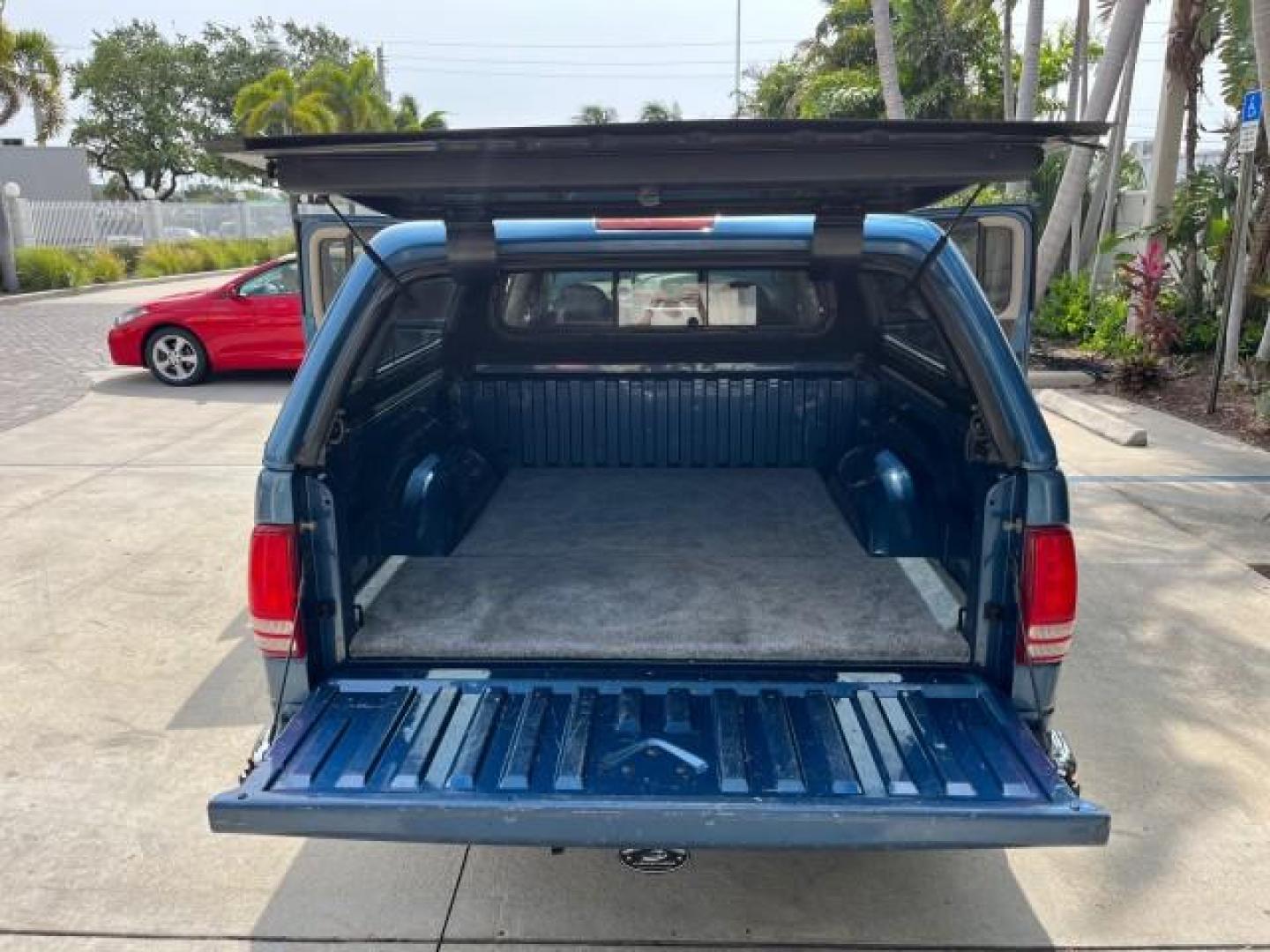 2003 Atlantic Blue Pearl /Dark Slate Gray Dodge Dakota SLT V8 LOW MILES 59,433 (1D7HL48N03S) with an 4.7L SOHC SMPI V8 Magnum Engine engine, Automatic transmission, located at 4701 North Dixie Hwy, Pompano Beach, FL, 33064, (954) 422-2889, 26.240938, -80.123474 - 2003 DODGE DAKOTA SLT ROAD READY 4.7L V8 VIN: 1D7HL48N03S351880 NO ACCIDENTS NO RECALLS CREW PICKUP LOW MILES 59,433 4.7L V8 F OHV 5.3 FT BED GASOLINE 6 SERVICE RECORDS REAR WHEEL DRIVE BACK UP CAMERA 5.3' Bed Length Alloy Wheels Approach Lights RWD THIS IS ONE OF THE NICEST DODGE S WE HAVE EVER LIS - Photo#15