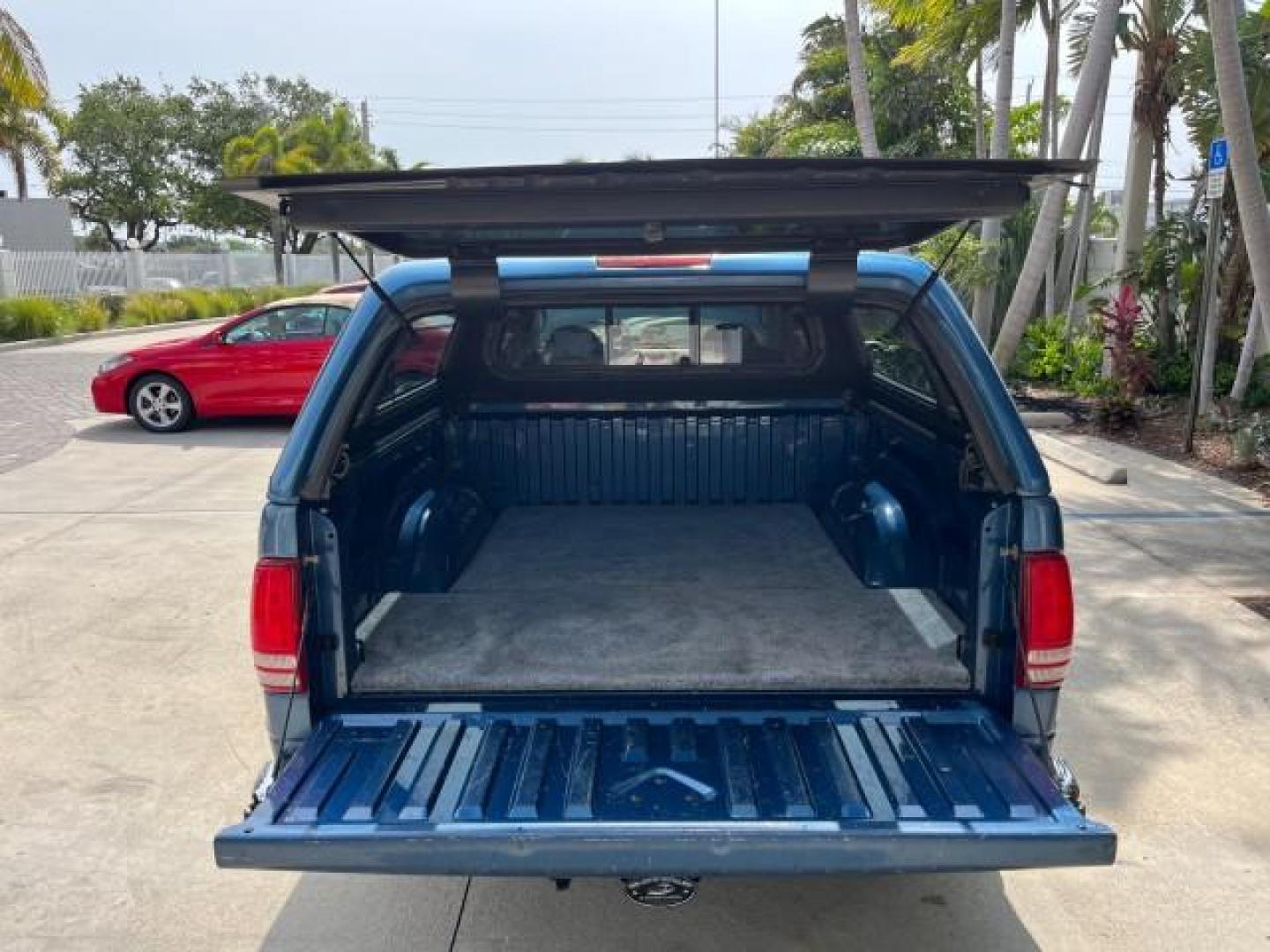 2003 Atlantic Blue Pearl /Dark Slate Gray Dodge Dakota SLT V8 LOW MILES 59,433 (1D7HL48N03S) with an 4.7L SOHC SMPI V8 Magnum Engine engine, Automatic transmission, located at 4701 North Dixie Hwy, Pompano Beach, FL, 33064, (954) 422-2889, 26.240938, -80.123474 - 2003 DODGE DAKOTA SLT ROAD READY 4.7L V8 VIN: 1D7HL48N03S351880 NO ACCIDENTS NO RECALLS CREW PICKUP LOW MILES 59,433 4.7L V8 F OHV 5.3 FT BED GASOLINE 6 SERVICE RECORDS REAR WHEEL DRIVE BACK UP CAMERA 5.3' Bed Length Alloy Wheels Approach Lights RWD THIS IS ONE OF THE NICEST DODGE S WE HAVE EVER LIS - Photo#62