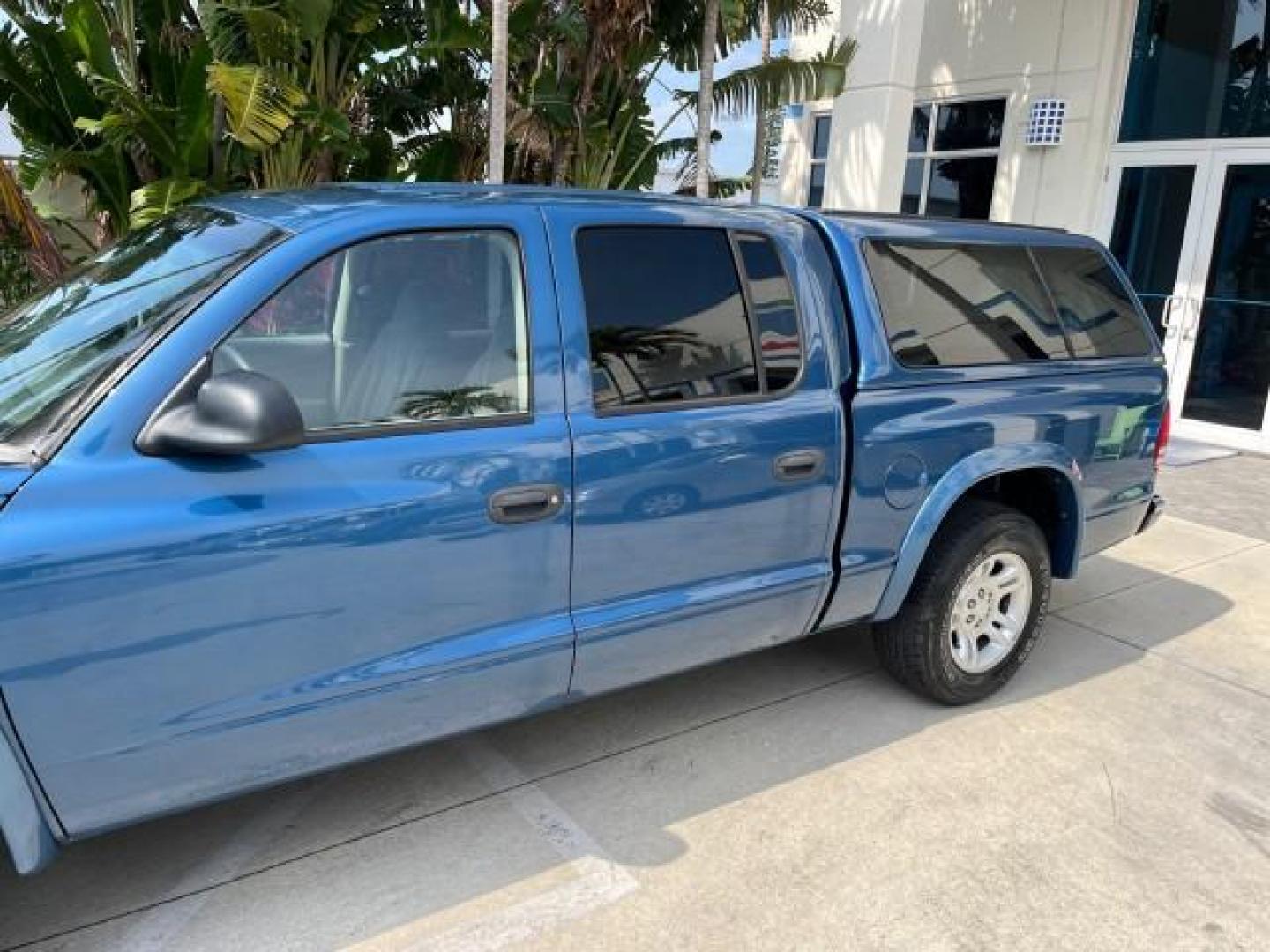 2003 Atlantic Blue Pearl /Dark Slate Gray Dodge Dakota SLT V8 LOW MILES 59,433 (1D7HL48N03S) with an 4.7L SOHC SMPI V8 Magnum Engine engine, Automatic transmission, located at 4701 North Dixie Hwy, Pompano Beach, FL, 33064, (954) 422-2889, 26.240938, -80.123474 - 2003 DODGE DAKOTA SLT ROAD READY 4.7L V8 VIN: 1D7HL48N03S351880 NO ACCIDENTS NO RECALLS CREW PICKUP LOW MILES 59,433 4.7L V8 F OHV 5.3 FT BED GASOLINE 6 SERVICE RECORDS REAR WHEEL DRIVE BACK UP CAMERA 5.3' Bed Length Alloy Wheels Approach Lights RWD THIS IS ONE OF THE NICEST DODGE S WE HAVE EVER LIS - Photo#86