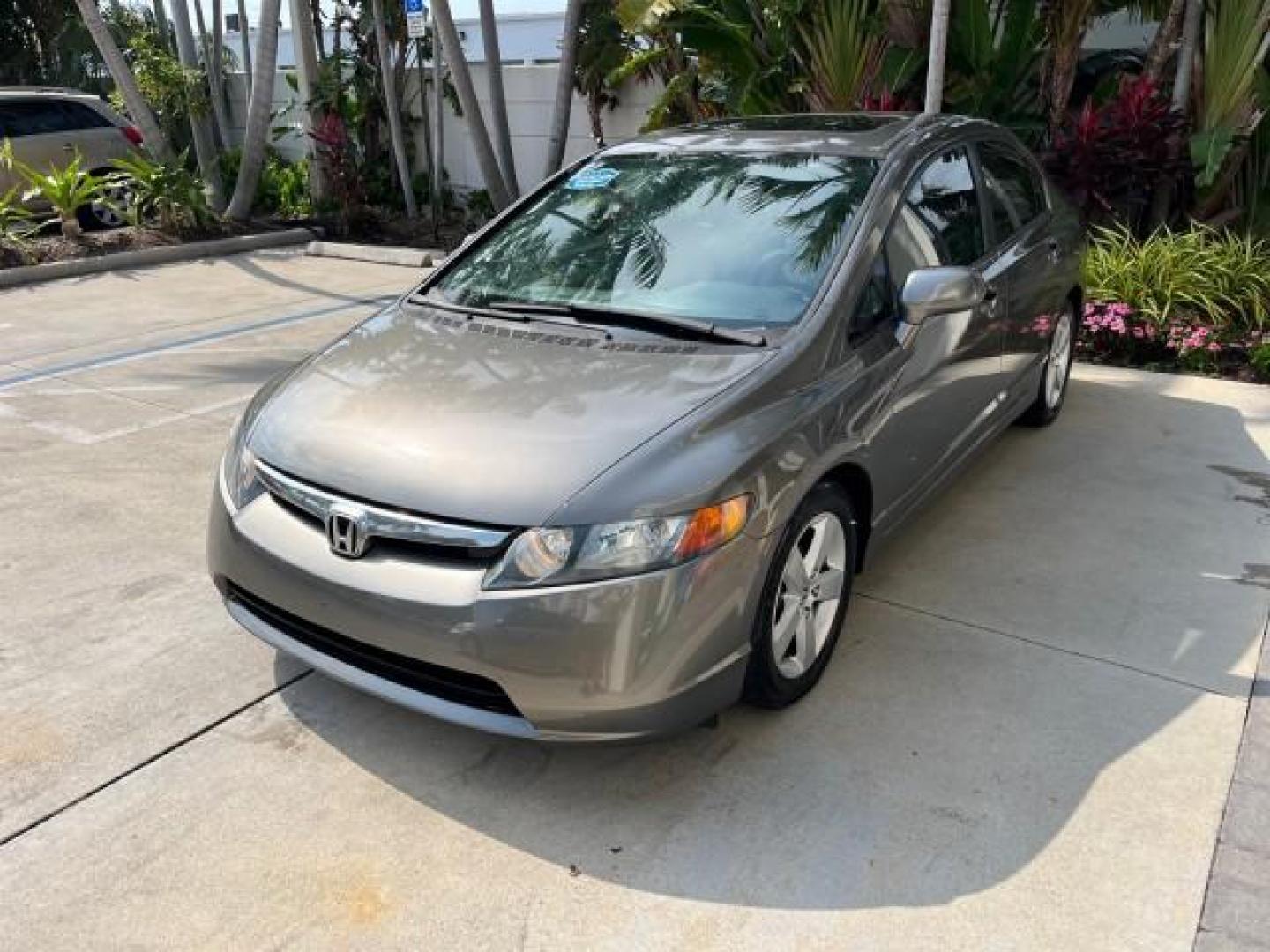 2007 Galaxy Gray Metallic /Gray Honda Civic Sdn EX LOW MILES 52,219 (1HGFA16867L) with an 1.8L SOHC MPFI 16-Valve i-VTEC I4 Engine engine, Automatic transmission, located at 4701 North Dixie Hwy, Pompano Beach, FL, 33064, (954) 422-2889, 26.240938, -80.123474 - OUR WEBPAGE FLORIDACARS1.COM HAS OVER 100 PHOTOS AND FREE CARFAX LINK 2007 HONDA CIVIC EX ROAD READY 1.8L I4 VIN: 1HGFA16867L141952 NO ACCIDENTS NO RECALLS SEDAN 4 DR FLORIDA OWNER 40 MPG 1.8L I4 F SOHC 16V POWER SUNROOF GASOLINE LOW MILES 52,219 FRONT WHEEL DRIVE 20 SERVICE RECORDS Alloy Wheels Ant - Photo#3