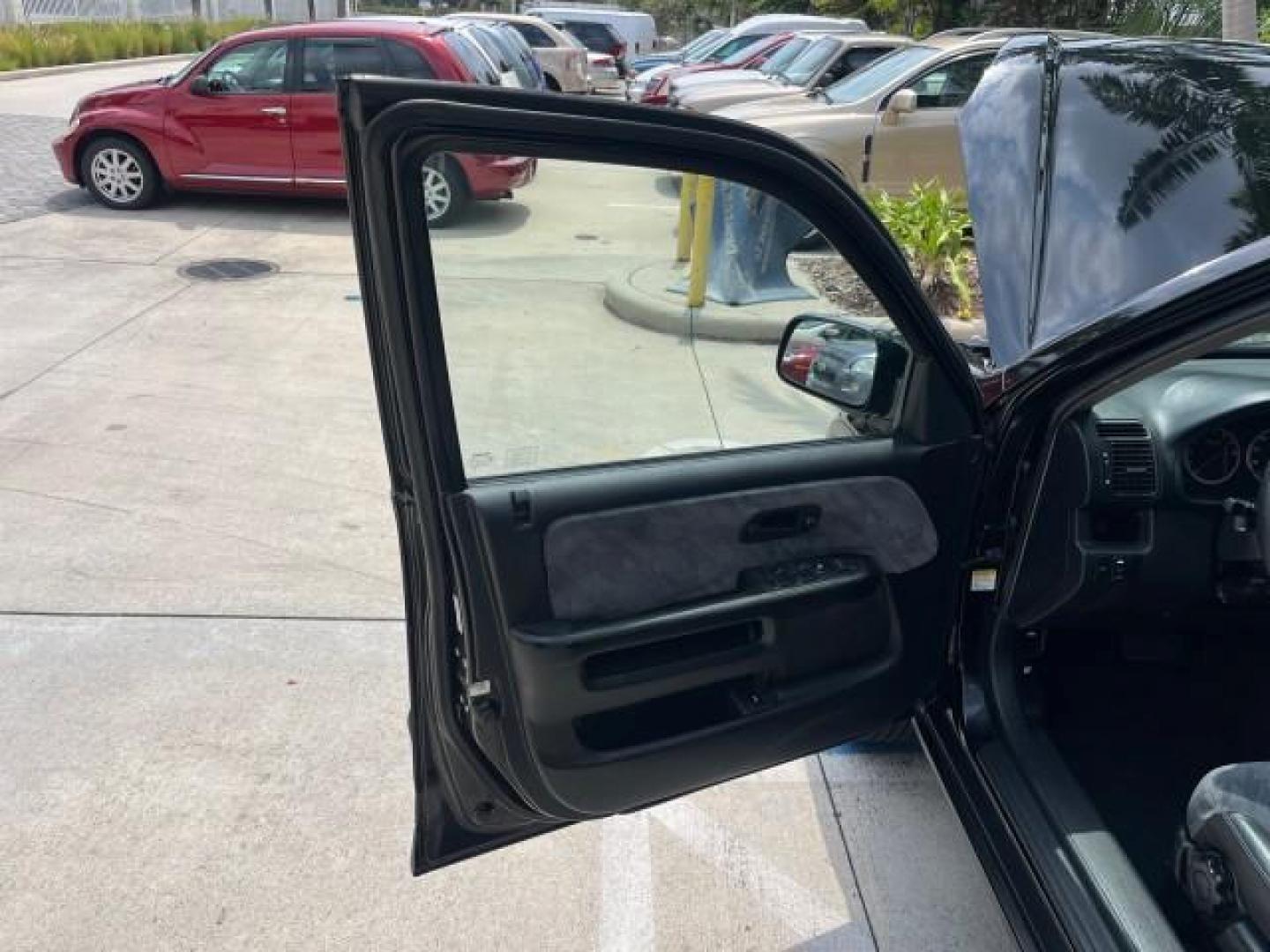 2003 Nighthawk Black Pearl /Black Honda CR-V 4X4 EX LOW MILES 73,207 (SHSRD78893U) with an 2.4L DOHC i-VTEC 16-Valve I4 Engine engine, Automatic transmission, located at 4701 North Dixie Hwy, Pompano Beach, FL, 33064, (954) 422-2889, 26.240938, -80.123474 - 2003 HONDA CR-V EX ROAD READY 2.4L I4 VIN: SHSRD78893U117766 NO ACCIDENTS 4 DOOR WAGON/SPORT UTILITY NO RECALLS 2.4L I4 F DOHC FLORIDA OWNER GASOLINE POWER SUNROOF LOW MILES 73,207 ALL WHEEL DRIVE ALL WHEEL DRIVE 17 SERVICE RECORDS AWD Alloy Wheels Approach Lights Cruise Control Front Bucket Seats M - Photo#9