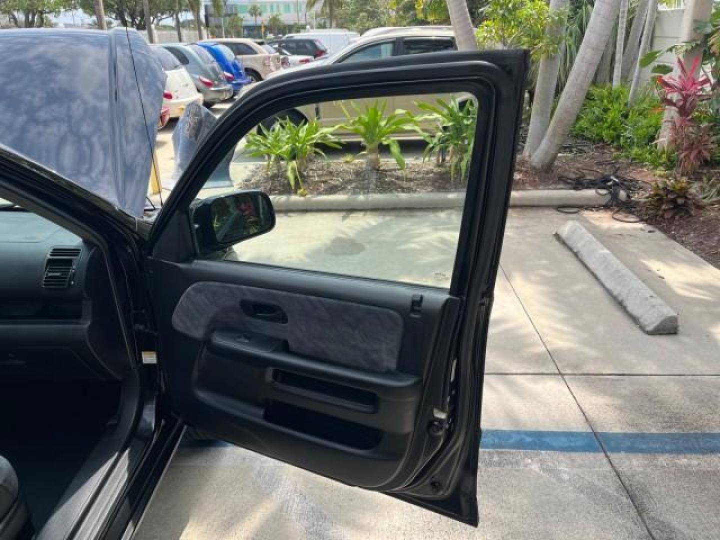 2003 Nighthawk Black Pearl /Black Honda CR-V 4X4 EX LOW MILES 73,207 (SHSRD78893U) with an 2.4L DOHC i-VTEC 16-Valve I4 Engine engine, Automatic transmission, located at 4701 North Dixie Hwy, Pompano Beach, FL, 33064, (954) 422-2889, 26.240938, -80.123474 - 2003 HONDA CR-V EX ROAD READY 2.4L I4 VIN: SHSRD78893U117766 NO ACCIDENTS 4 DOOR WAGON/SPORT UTILITY NO RECALLS 2.4L I4 F DOHC FLORIDA OWNER GASOLINE POWER SUNROOF LOW MILES 73,207 ALL WHEEL DRIVE ALL WHEEL DRIVE 17 SERVICE RECORDS AWD Alloy Wheels Approach Lights Cruise Control Front Bucket Seats M - Photo#11