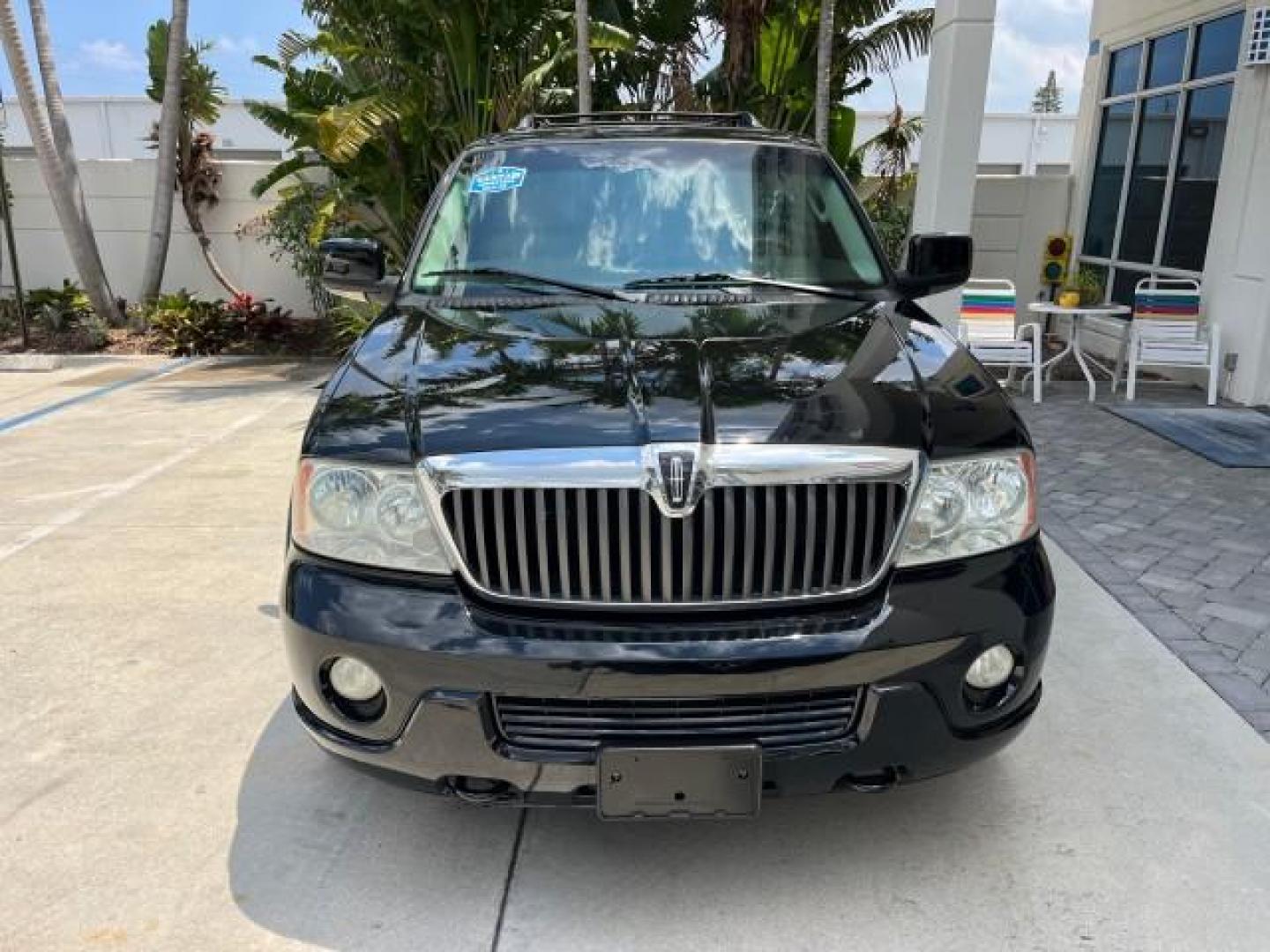 2003 Black /Light Parchment Lincoln Navigator AWD Luxury LOW MILES 74,590 (5LMFU28R43L) with an 5.4L DOHC 32-Valve V8 Intech Engine engine, Automatic transmission, located at 4701 North Dixie Hwy, Pompano Beach, FL, 33064, (954) 422-2889, 26.240938, -80.123474 - OUR WEBPAGE FLORIDACARS1.COM HAS OVER 100 PHOTOS AND FREE CARFAX LINK 2003 LINCOLN NAVIGATOR LUXURY ROAD READY 5.4L V8 VIN: 5LMFU28R43LJ04497 NO RECALLS AWD 4 DOOR WAGON/SPORT UTILITY POWER LEATHER SEATS 5.4L V8 F DOHC LOW MILES 74,590 GASOLINE 3 ROW SEATS 32 SERVICE RECORDS ALL WHEEL DRIVE POWER SU - Photo#2