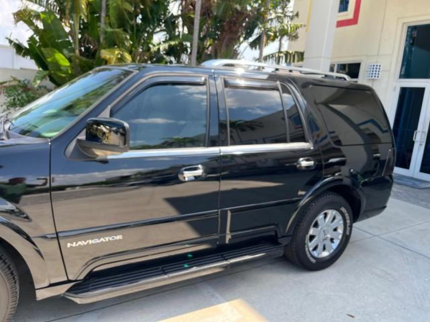 2003 Black /Light Parchment Lincoln Navigator AWD Luxury LOW MILES 74,590 (5LMFU28R43L) with an 5.4L DOHC 32-Valve V8 Intech Engine engine, Automatic transmission, located at 4701 North Dixie Hwy, Pompano Beach, FL, 33064, (954) 422-2889, 26.240938, -80.123474 - OUR WEBPAGE FLORIDACARS1.COM HAS OVER 100 PHOTOS AND FREE CARFAX LINK 2003 LINCOLN NAVIGATOR LUXURY ROAD READY 5.4L V8 VIN: 5LMFU28R43LJ04497 NO RECALLS AWD 4 DOOR WAGON/SPORT UTILITY POWER LEATHER SEATS 5.4L V8 F DOHC LOW MILES 74,590 GASOLINE 3 ROW SEATS 32 SERVICE RECORDS ALL WHEEL DRIVE POWER SU - Photo#77